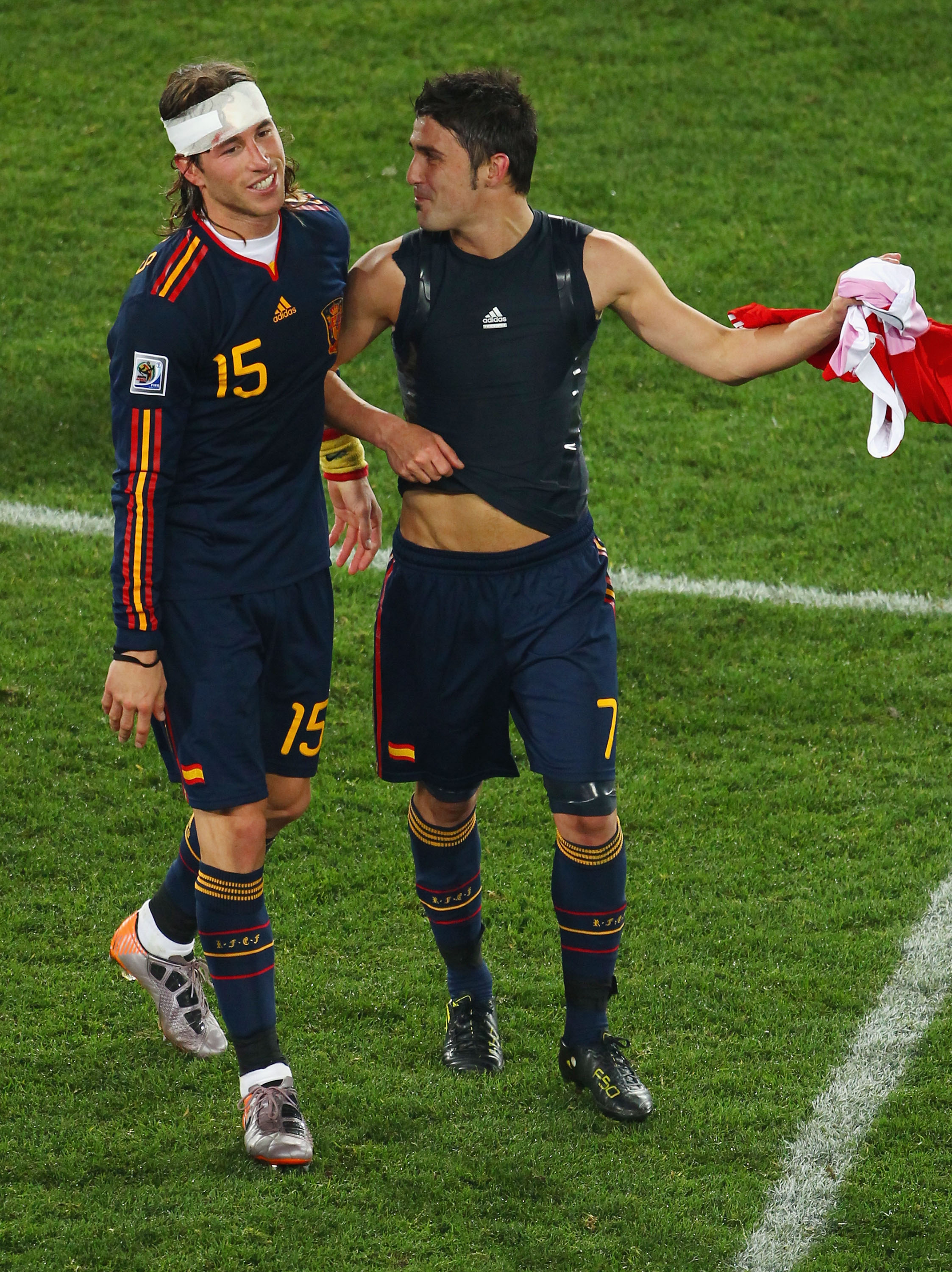 JOHANNESBURG, SOUTH AFRICA - JULY 03:  Sergio Ramos of Spain celebrates with David Villa after victory and progress to the semi finals during the 2010 FIFA World Cup South Africa Quarter Final match between Paraguay and Spain at Ellis Park Stadium on July