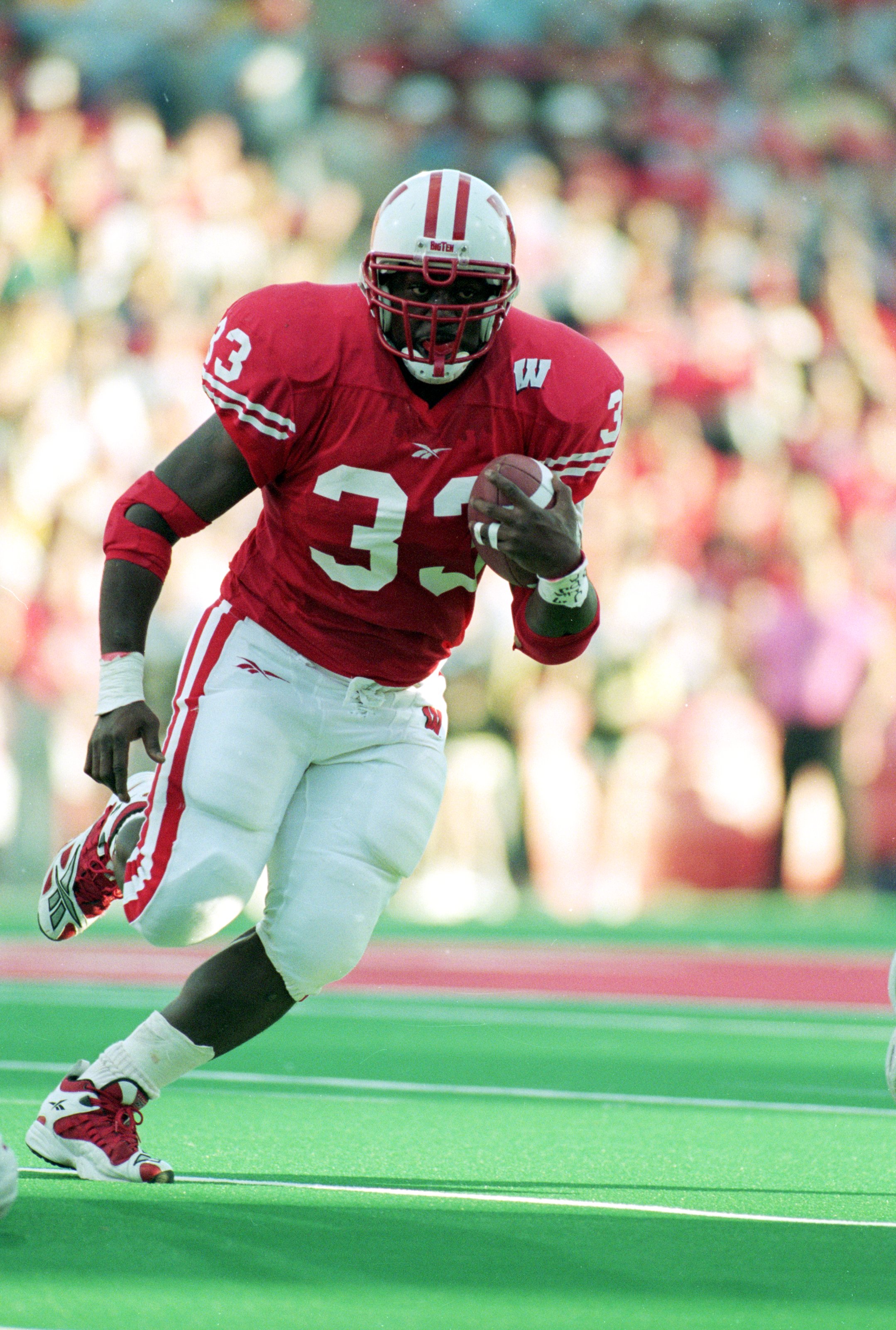 13 Nov 1999: Ron Dayne #33 of the Wisconsin Badgers carries the ball  during the game against the  Iowa Hawkeyes at the Camp Randall Stadium in Madison, Wisconsin. The Badgers defeated the Hawkeyes 41-3. Mandatory Credit: Matthew Stockman  /Allsport