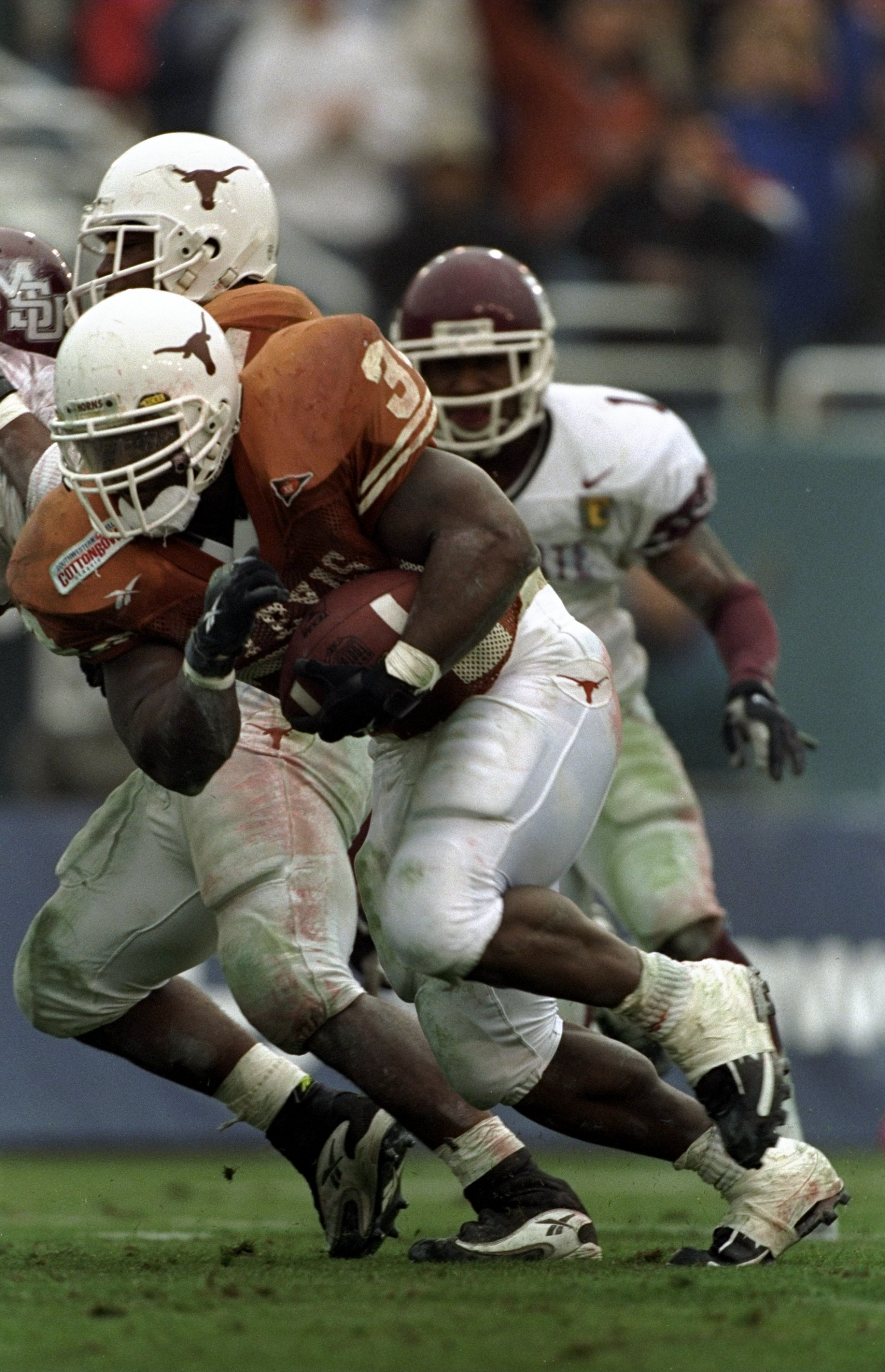 1 Jan 1999: Ricky Williams #34 of the Texas Longhorns carries the ball during the Southwest Bell Cotton Bowl against the Mississippi State Bulldogs at the Cotton Bowl in Dallas, Texas. Texas defeated Mississippi St 38-11. Mandatory Credit: Brian Bahr  /Al