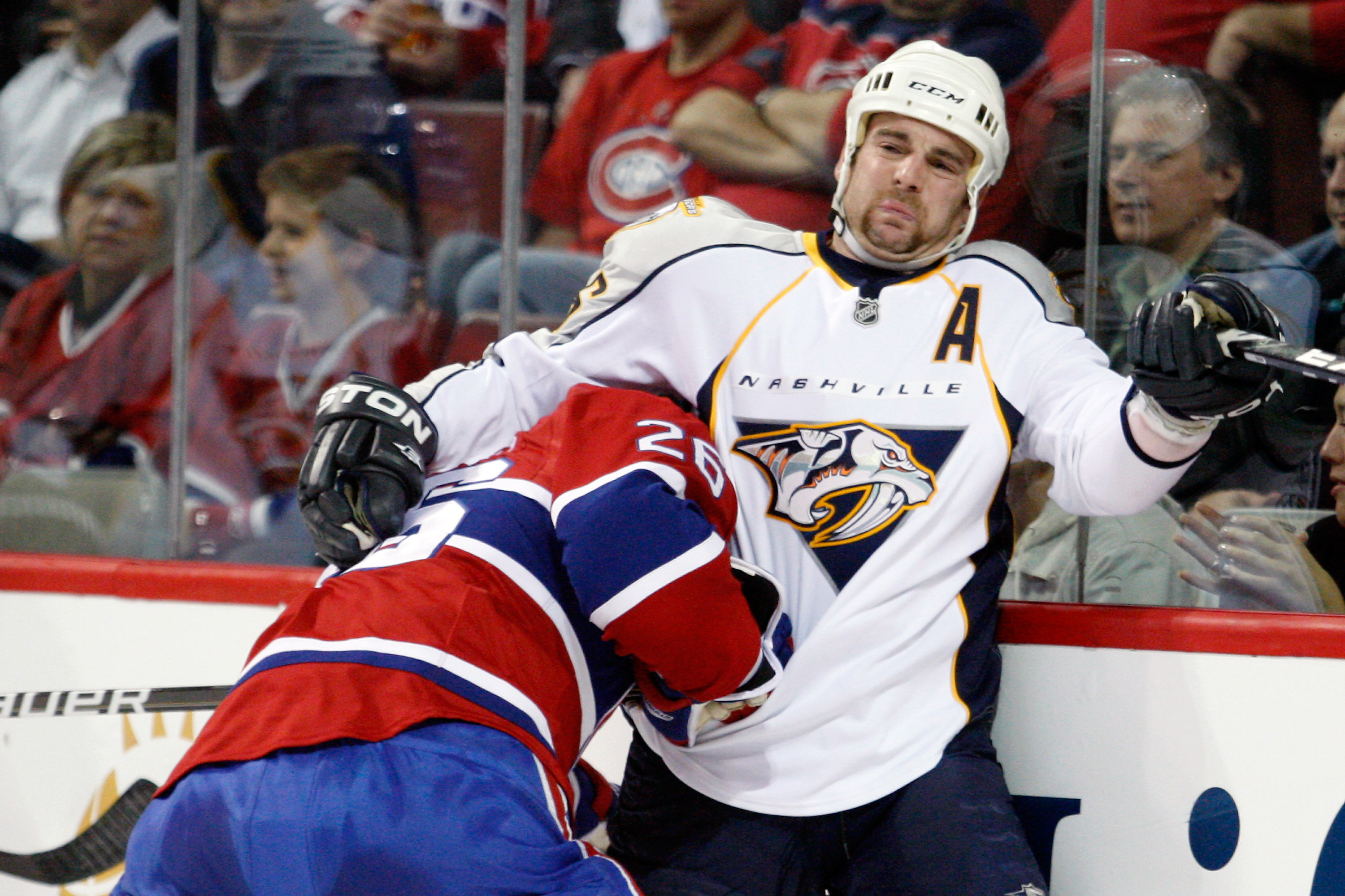 MONTREAL- NOVEMBER 18:  Josh Gorges #26 of the Montreal Canadiens body checks Steve Sullivan #26 of the Nashville Predators during the NHL game at the Bell Centre on November 18, 2010 in Montreal, Quebec, Canada.  (Photo by Richard Wolowicz/Getty Images)