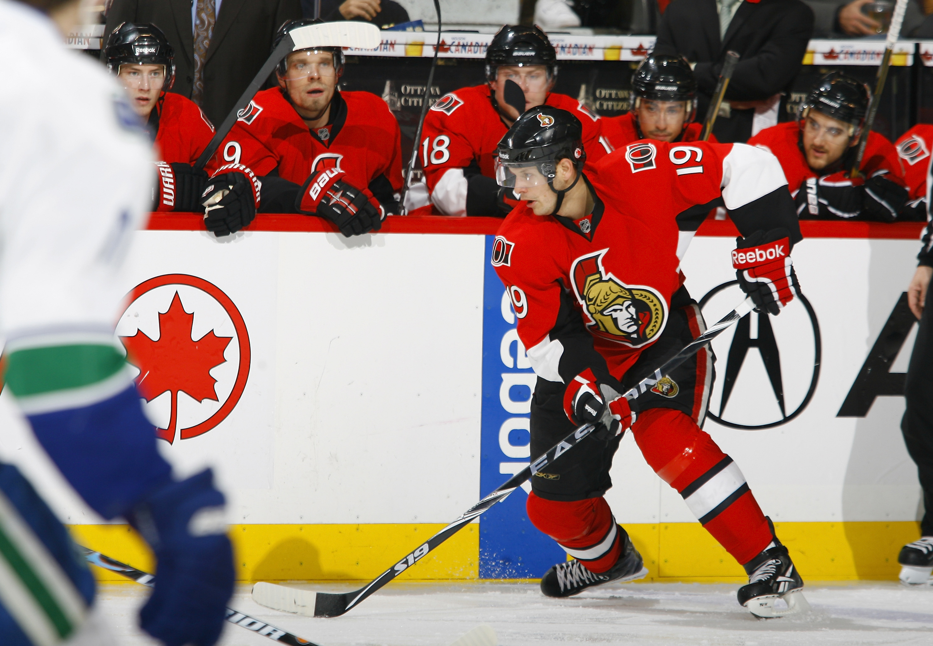 OTTAWA, CANADA - NOVEMBER 11:  Jason Spezza #19 of the Ottawa Senators carries the puck up the far boards during a game against the Vancouver Canucks at Scotiabank Place on November 11, 2010 in Ottawa, Ontario, Canada.  (Photo by Phillip MacCallum/Getty I