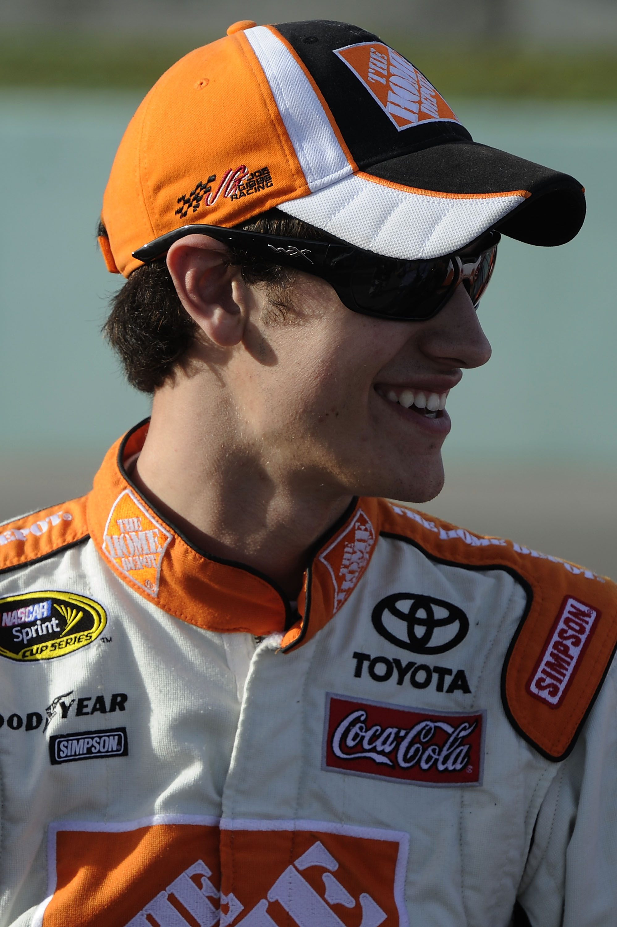 HOMESTEAD, FL - NOVEMBER 19:  Joey Logano, driver of the #20 Home Depot Toyota, walks on the grid during qualifying for the NASCAR Sprint Cup Series Ford 400 at Homestead-Miami Speedway on November 19, 2010 in Homestead, Florida.  (Photo by John Harrelson