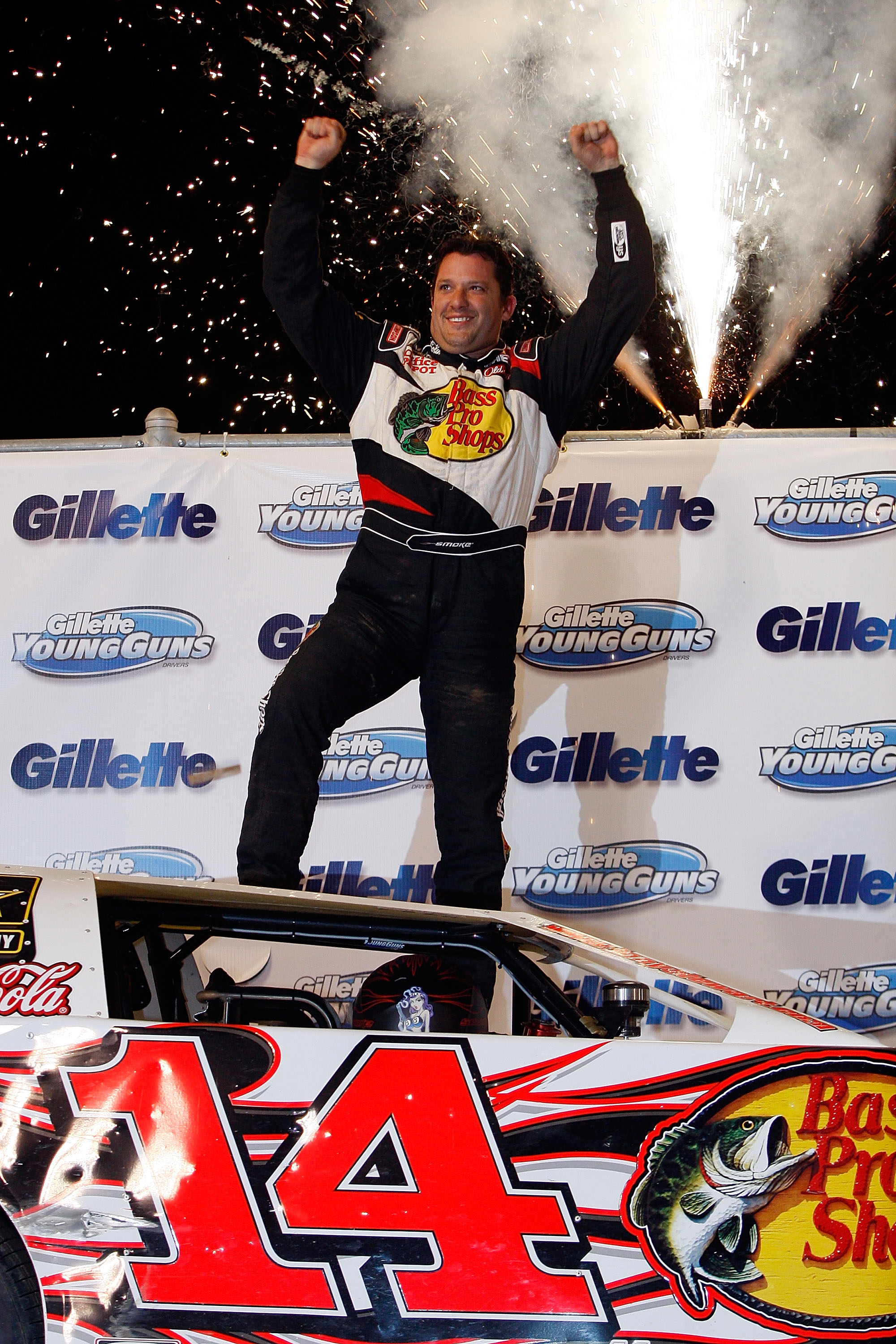 ROSSBURG, OH - SEPTEMBER 09:  Tony Stewart, driver of the #14 celebrates after winning the Gillette Young Guns Prelude to the Dream at Eldora Speedway on September 9, 2009 in Rossburg, Ohio.  (Photo by Chris Graythen/Getty Images for True Speed Communicat