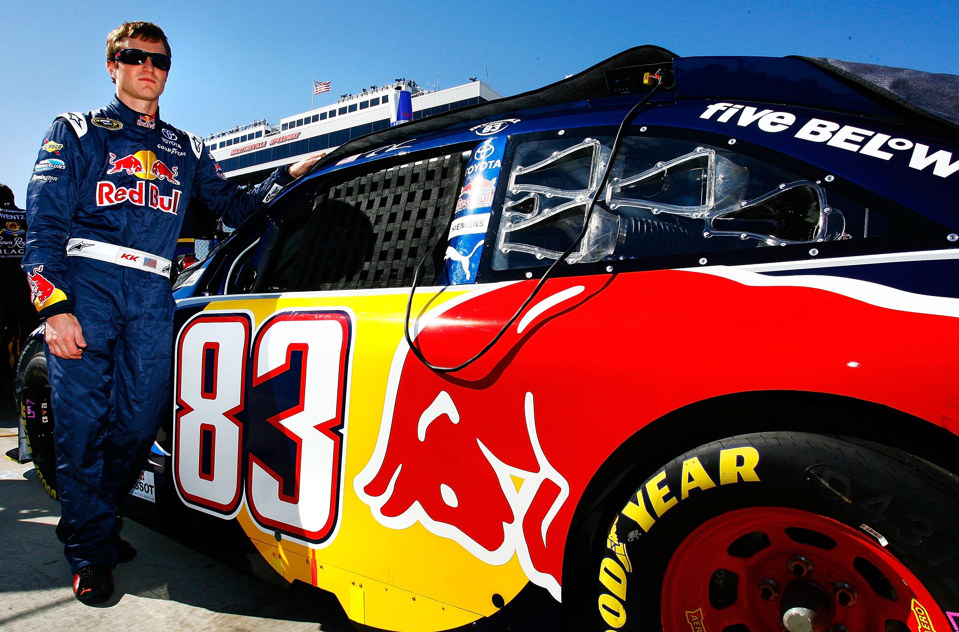 MARTINSVILLE, VA - OCTOBER 24:  Kasey Kahne, driver of the #83 Red Bull Toyota, stands next to his car on the grid prior to the NASCAR Sprint Cup Series TUMS Fast Relief 500 at Martinsville Speedway on October 24, 2010 in Martinsville, Virginia.  (Photo b