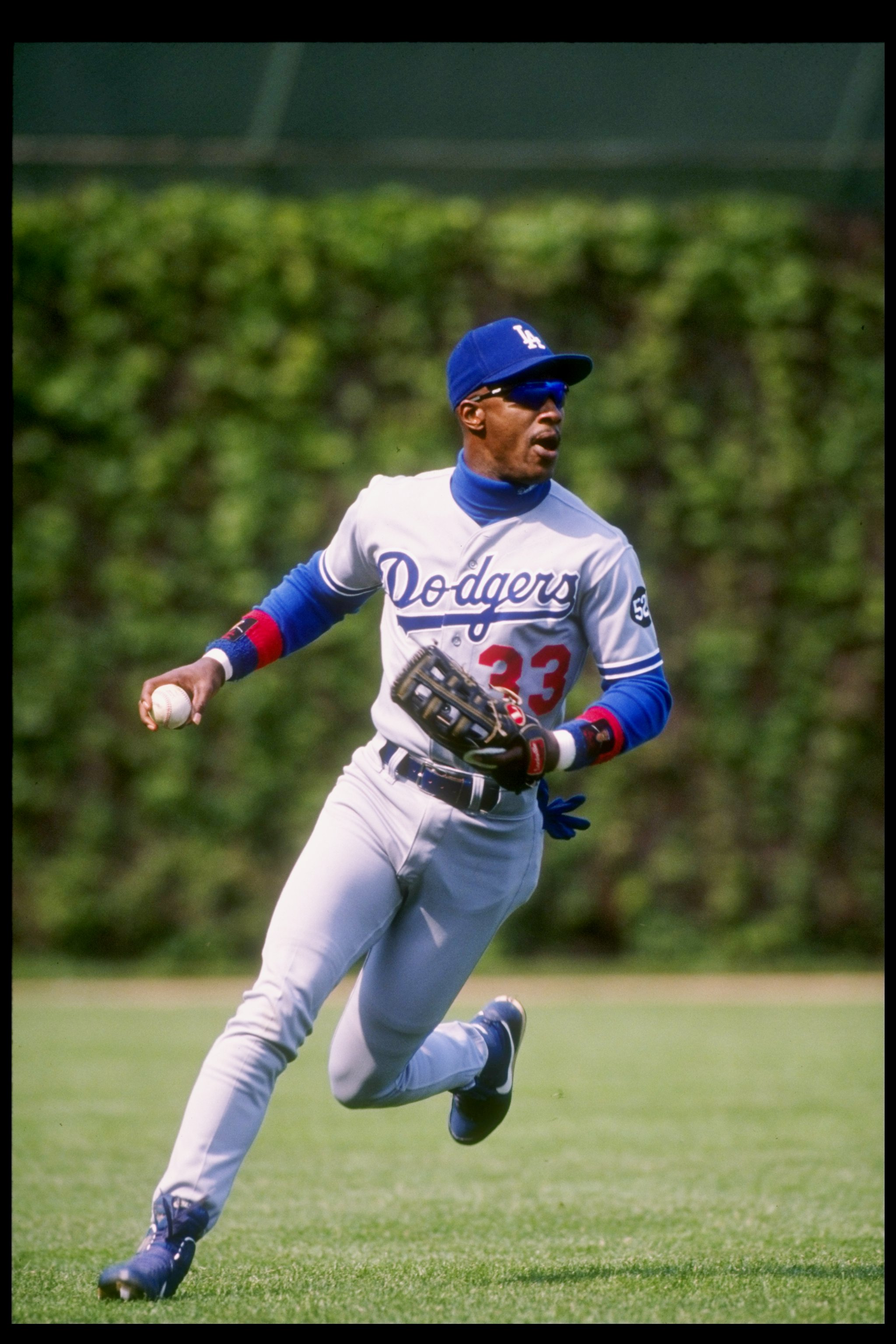 11 May 1993:  Outfielder Eric Davis of the Los Angeles Dodgers looks to throw the ball during a game against the Chicago Cubs at Wrigley Field in Chicago, Illinois. Mandatory Credit: Jonathan Daniel  /Allsport