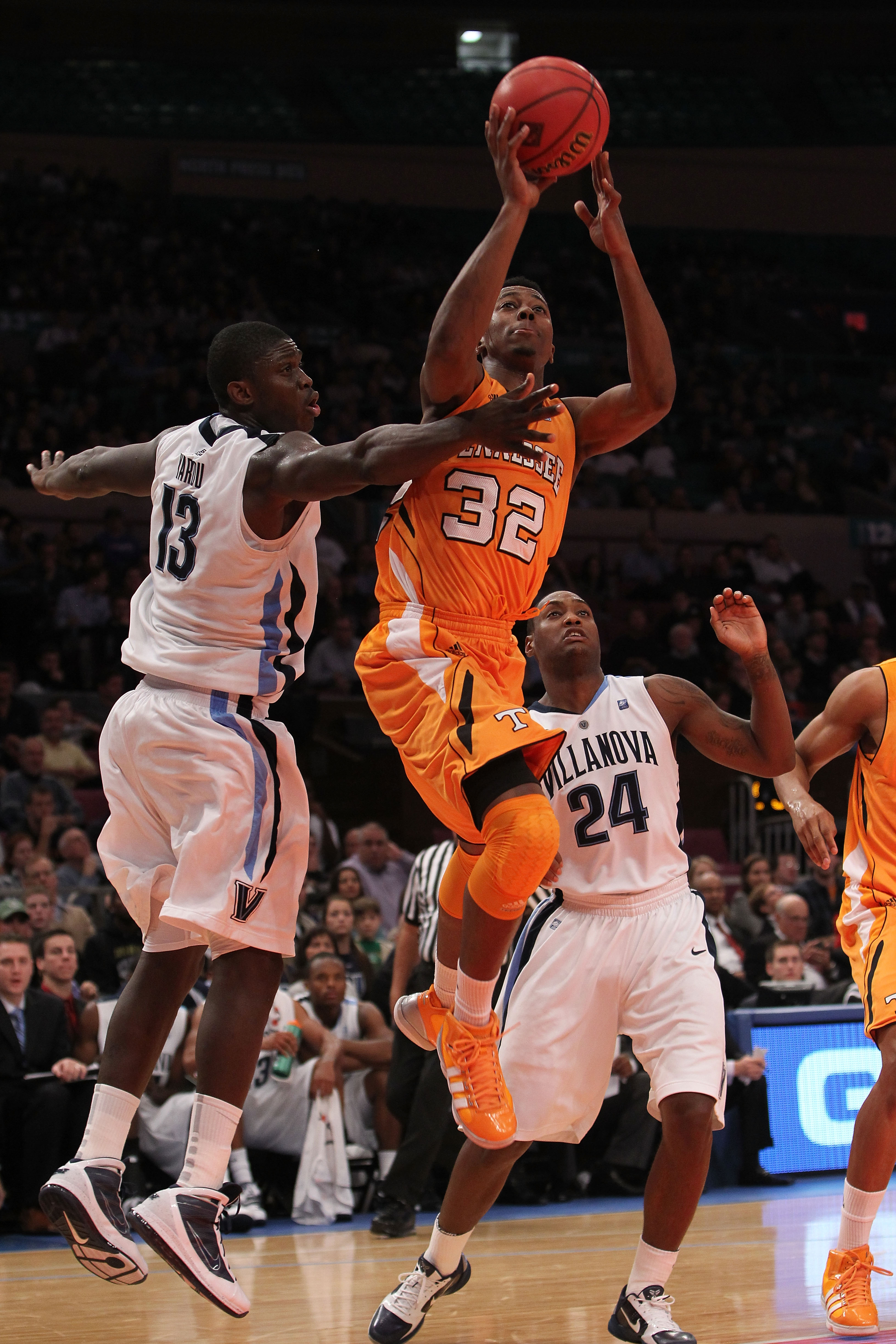 NEW YORK - NOVEMBER 26:  Scotty Hopson #32 of the Tennessee Volunteers shoots the ball despite the block from Mouphtaou Yarou #13 of the Villanova Wildcats  during the Championship game at Madison Square Garden on November 26, 2010 in New York City.  (Pho