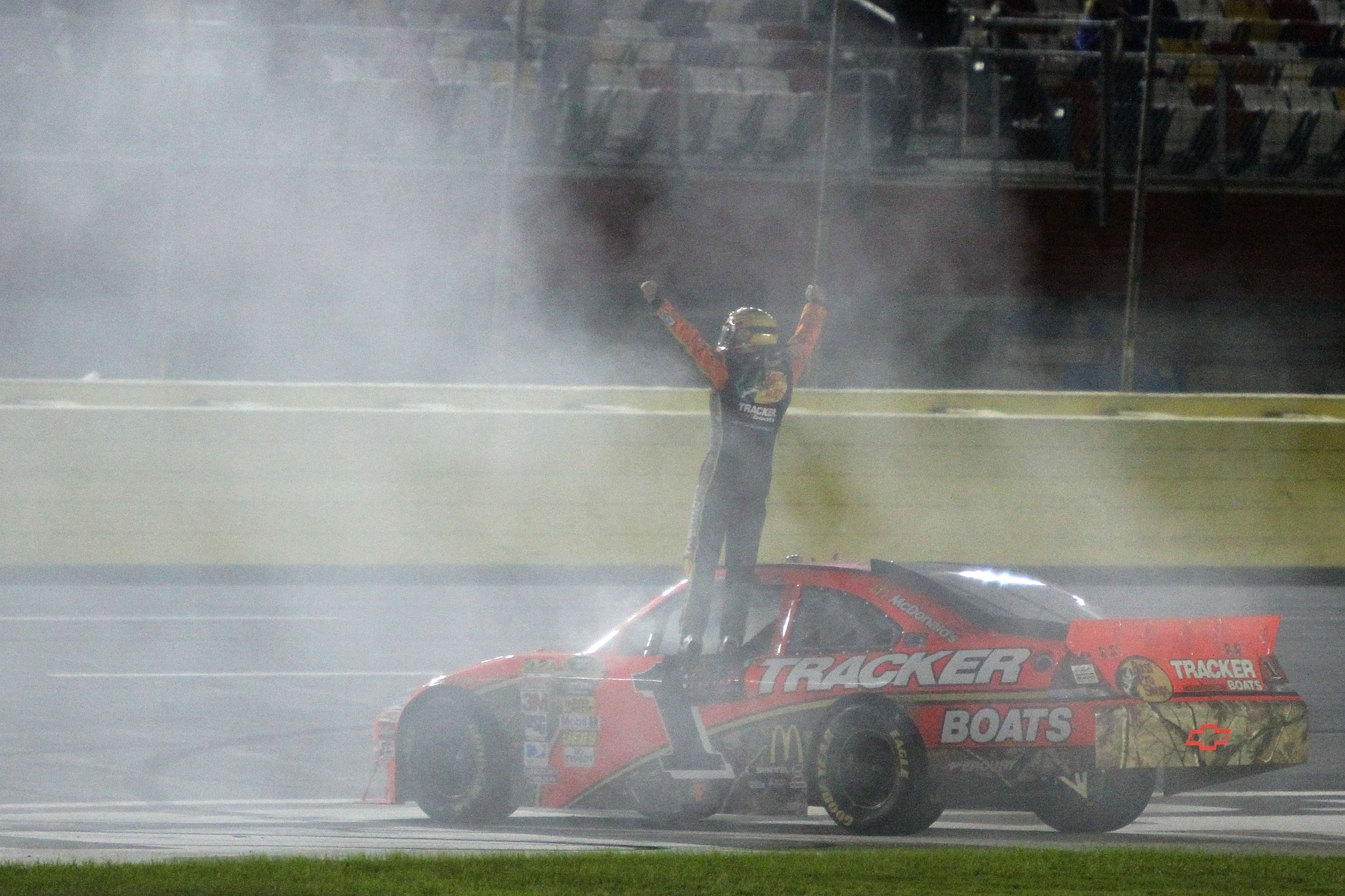 CONCORD, NC - OCTOBER 16:  Jamie McMurray, driver of the #1 Bass Pro Shops/Tracker Boats Chevrolet, celebrates on track after winning the NASCAR Sprint Cup Series Bank of America 500 at Charlotte Motor Speedway on October 16, 2010 in Concord, North Caroli