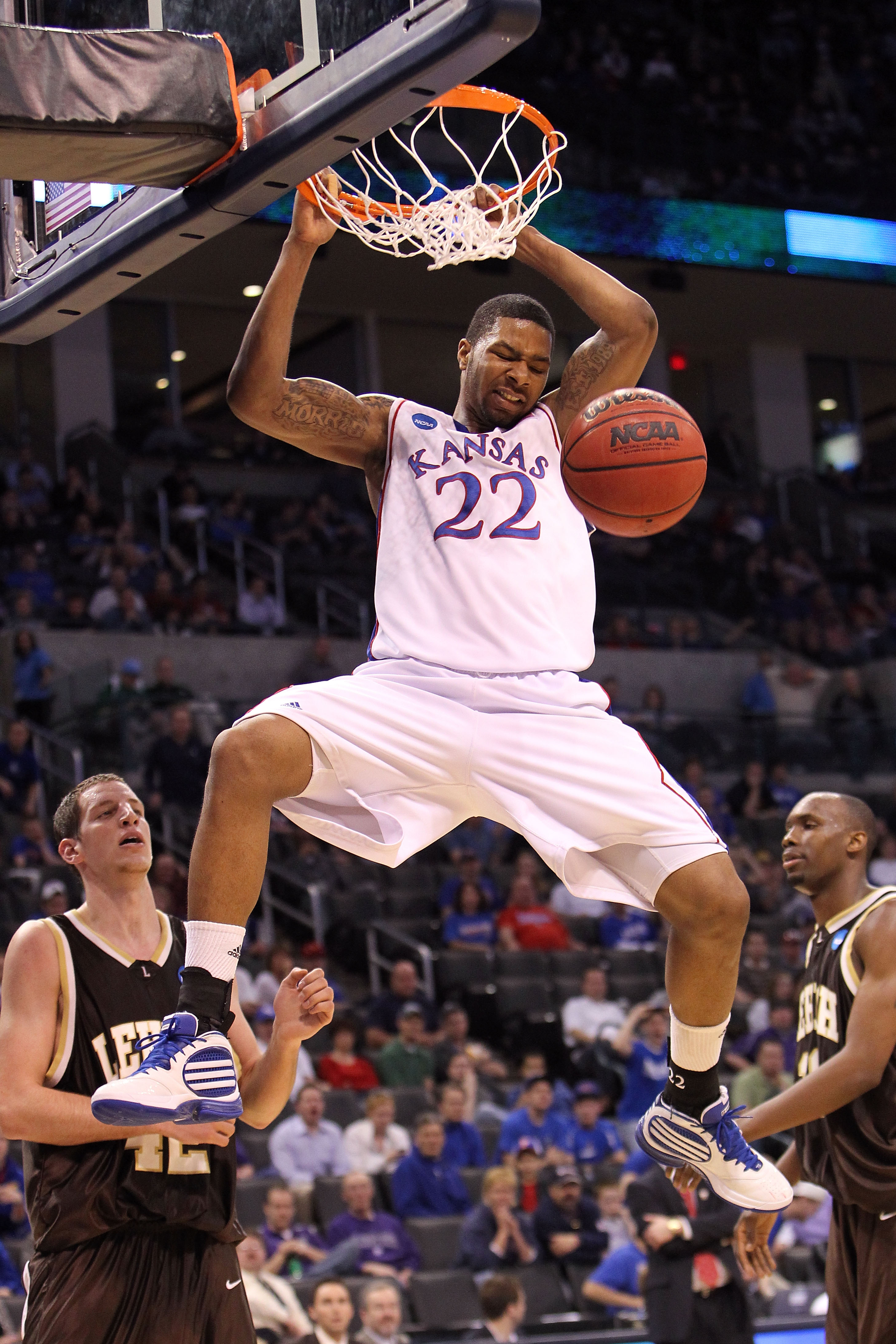 OKLAHOMA CITY - MARCH 18:  Marcus Morris #22 of the Kansas Jayhawks dunks against the Lehigh Mountain Hawks during the first round of the 2010 NCAA men's basketball tournament at Ford Center on March 18, 2010 in Oklahoma City, Oklahoma.  (Photo by Ronald