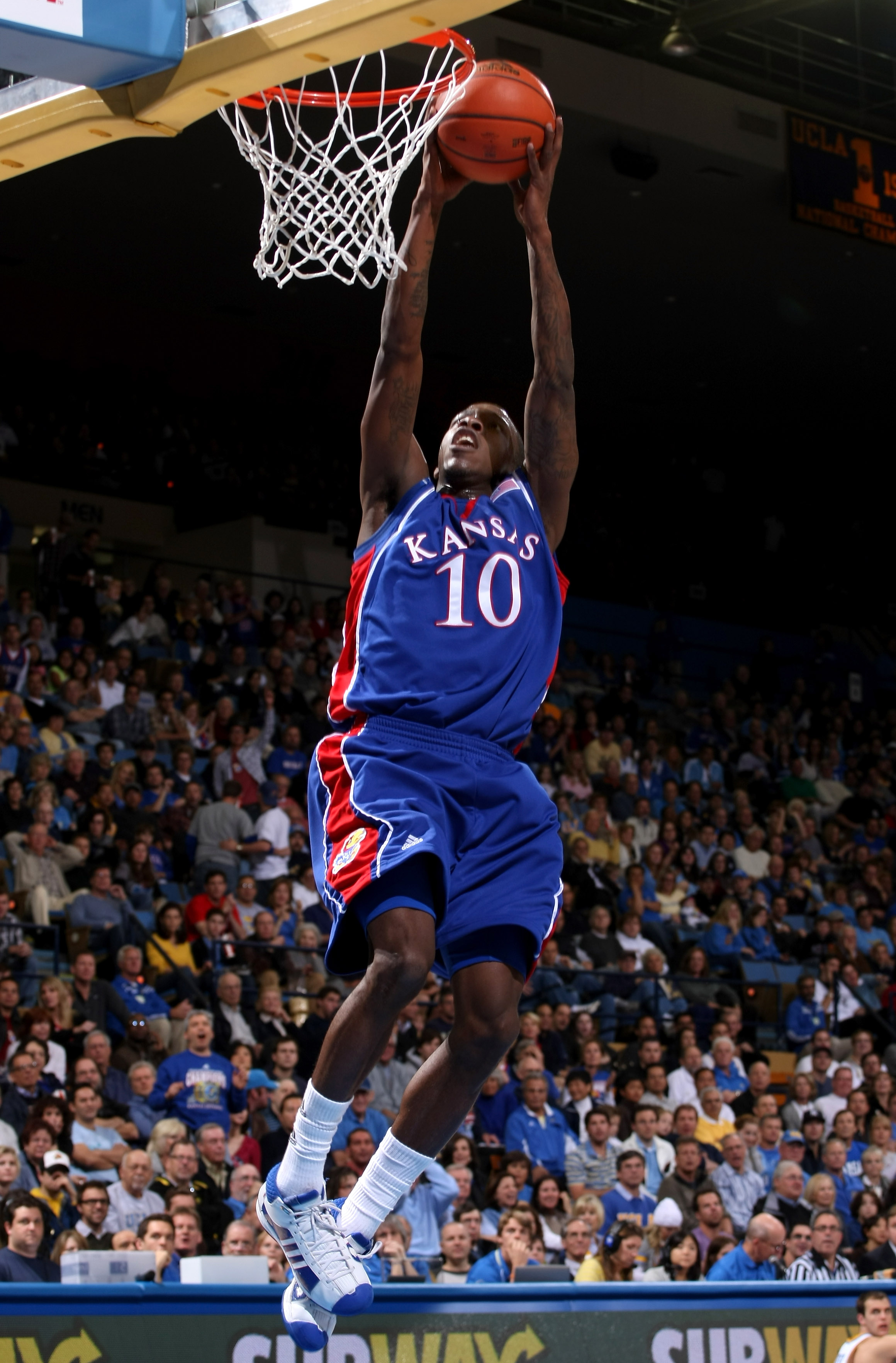 WESTWOOD, CA - DECEMBER 6:  Tyshawn Taylor #10 of the Kansas Jayhawks goes up to dunk against the UCLA Bruins on December 6, 2009 at Pauley Pavillion in Westwood, California.    (Photo by Stephen Dunn/Getty Images)