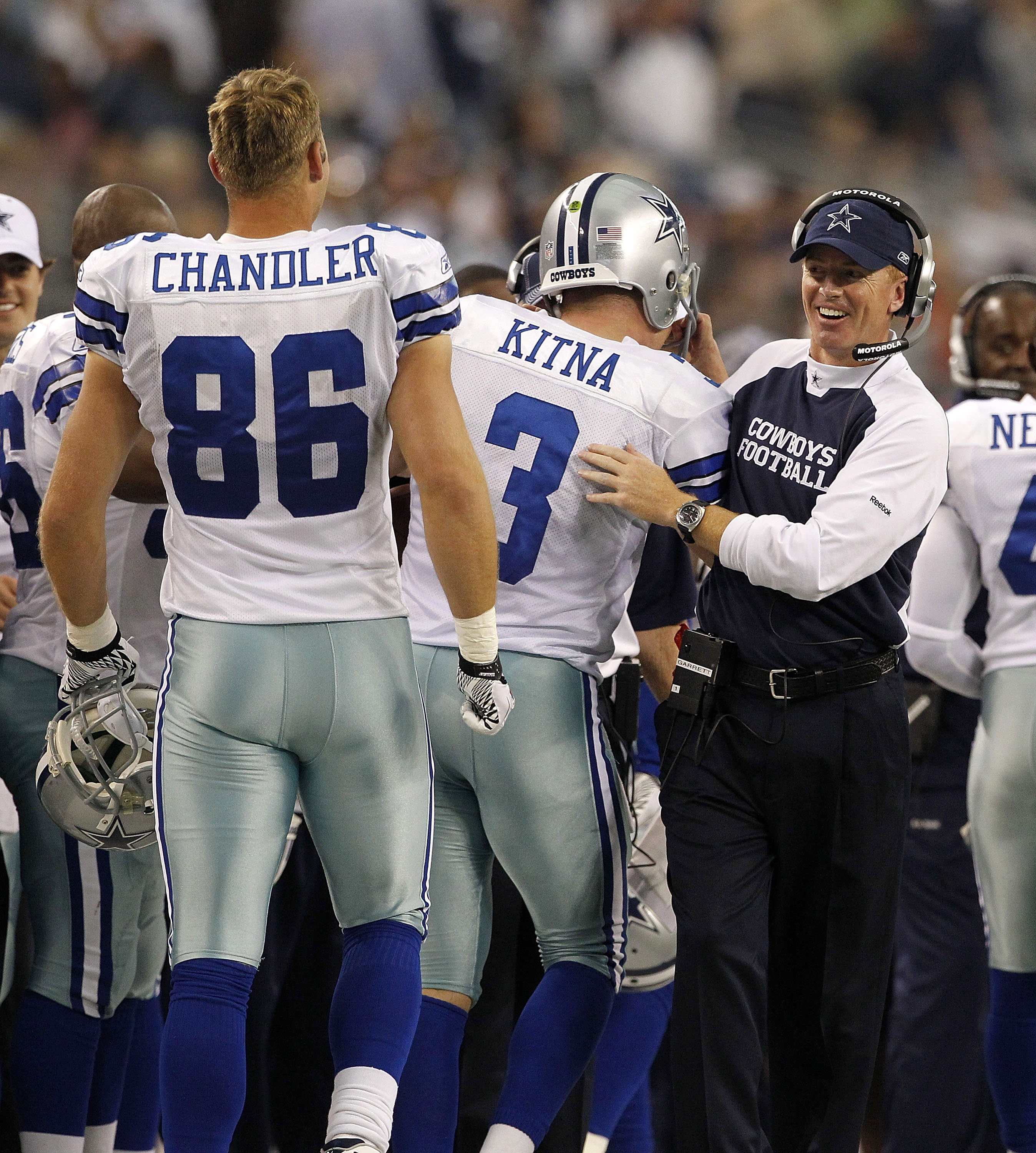 Dallas Cowboys head coach Jason Garrett talks to staff on the sideline  during warm ups before a preseason NFL football game against the Oakland  Raiders on Saturday, Aug. 26, 2017, in Arlington