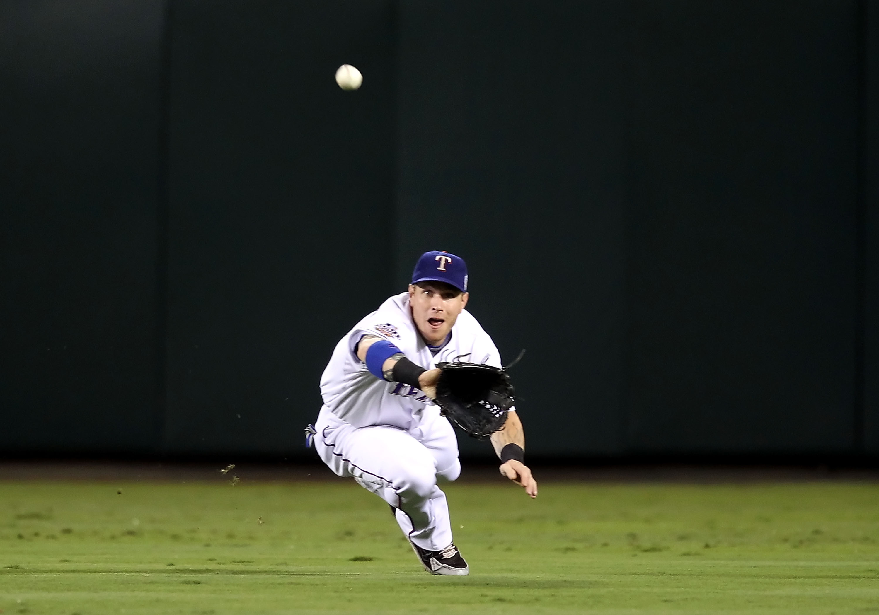 ARLINGTON, TX - OCTOBER 31:  Josh Hamilton #32 of the Texas Rangers makes a diving catch in the second inning against the San Francisco Giants in Game Four of the 2010 MLB World Series at Rangers Ballpark in Arlington on October 31, 2010 in Arlington, Tex