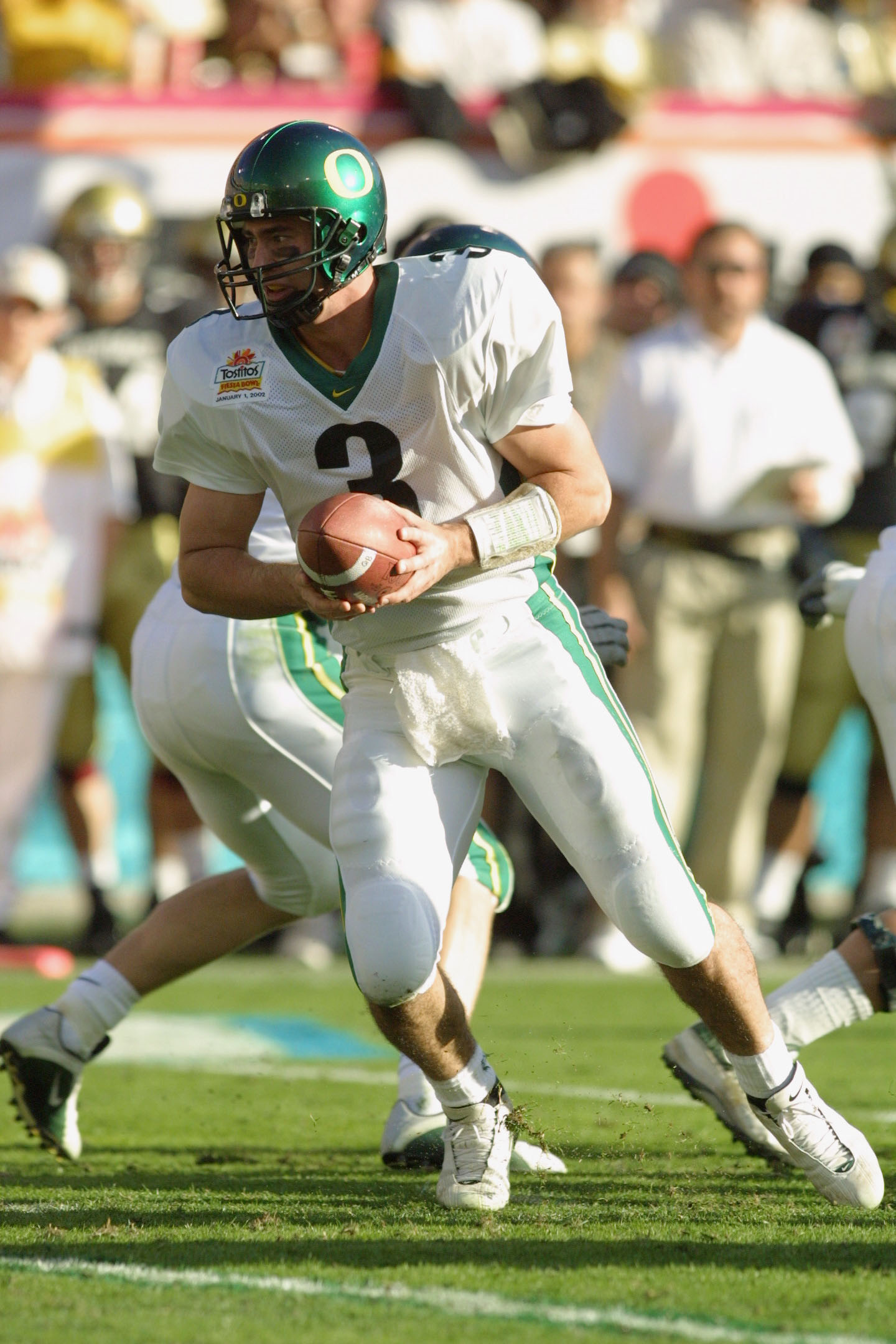 01 Jan 2002 : Quarterback Joey Harrington of Oregon looks for an opening against Colorado during the game at the  Fiesta Bowl at Sun Devil Stadium in Tempe, Arizona. The Oregon Ducks won 38-16. DIGITAL IMAGE. Mandatory Credit: Jeff Gross/Getty Images