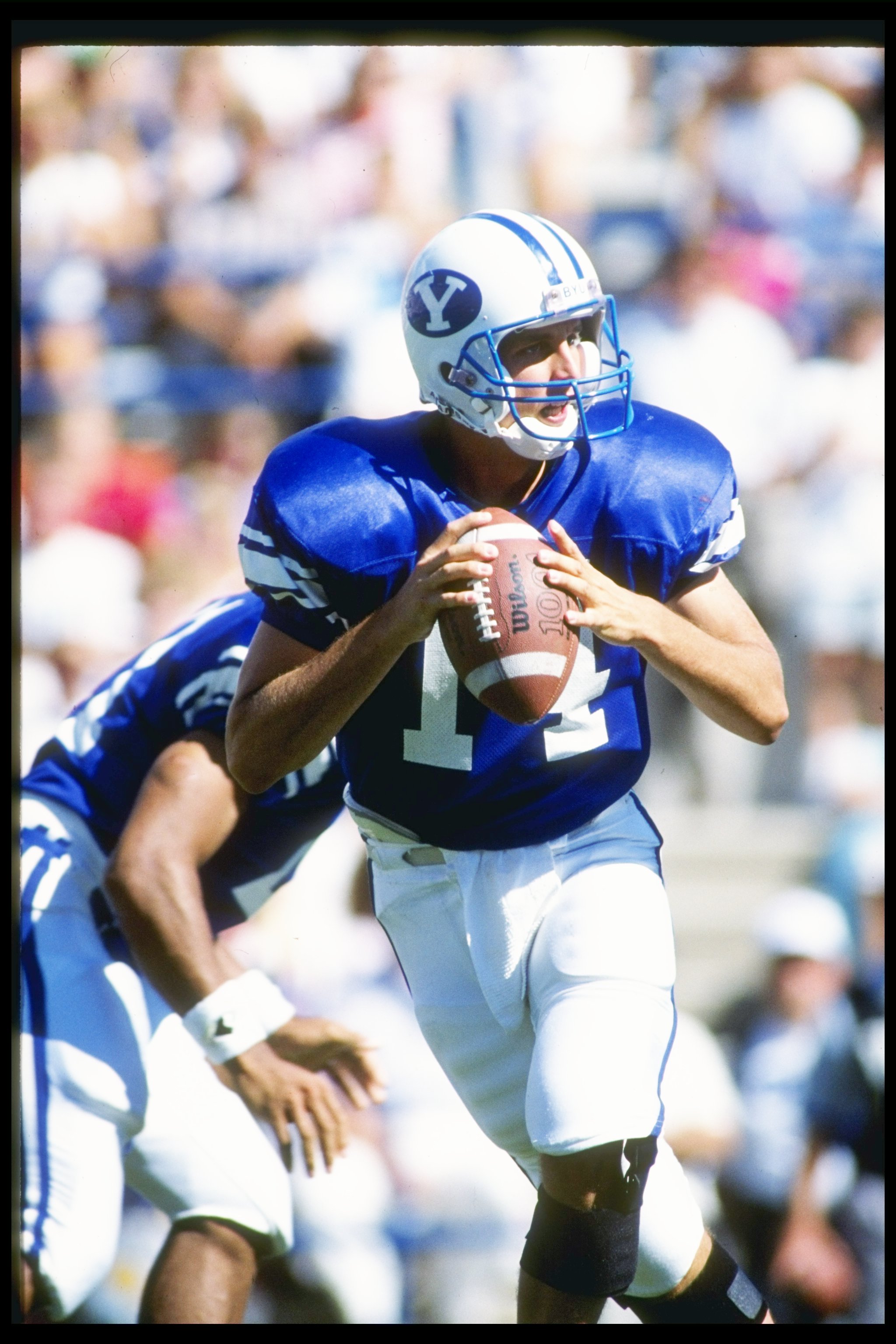 22 Sep 1990:  Quarterback Ty Detmer of the Brigham Young Cougars drops back to pass during a game against the San Diego State Aztecs at Cougar Stadium in Provo, Utah.  Brigham Young won the game 62-34. Mandatory Credit: Mike Powell  /Allsport