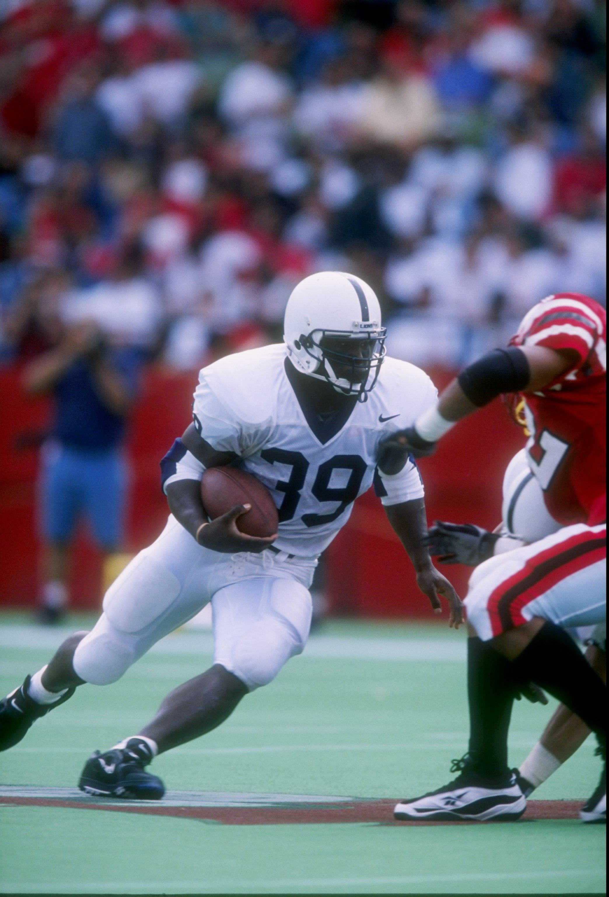 20 Sep 1997: Tailback Curtis Enis of the Penn State Nittany Lions runs down the field during a game against the Louisville Cardinals at Cardinal Stadium in Louisville, Kentucky. Penn State won the game 50-14