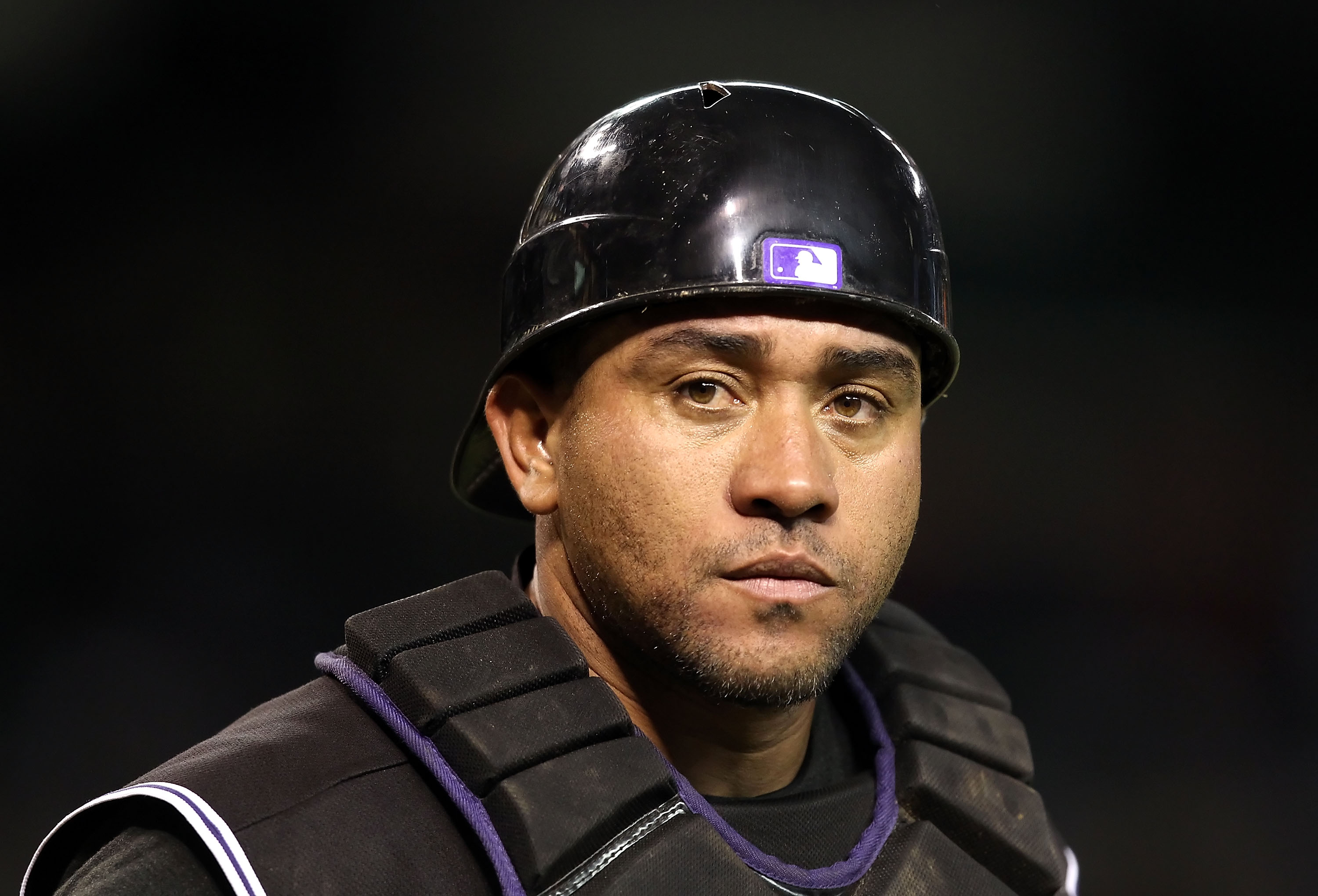 PHOENIX - SEPTEMBER 21:  Catcher Miguel Olivo #21 of the Colorado Rockies during the Major League Baseball game against the Arizona Diamondbacks at Chase Field on September 21, 2010 in Phoenix, Arizona.  (Photo by Christian Petersen/Getty Images)
