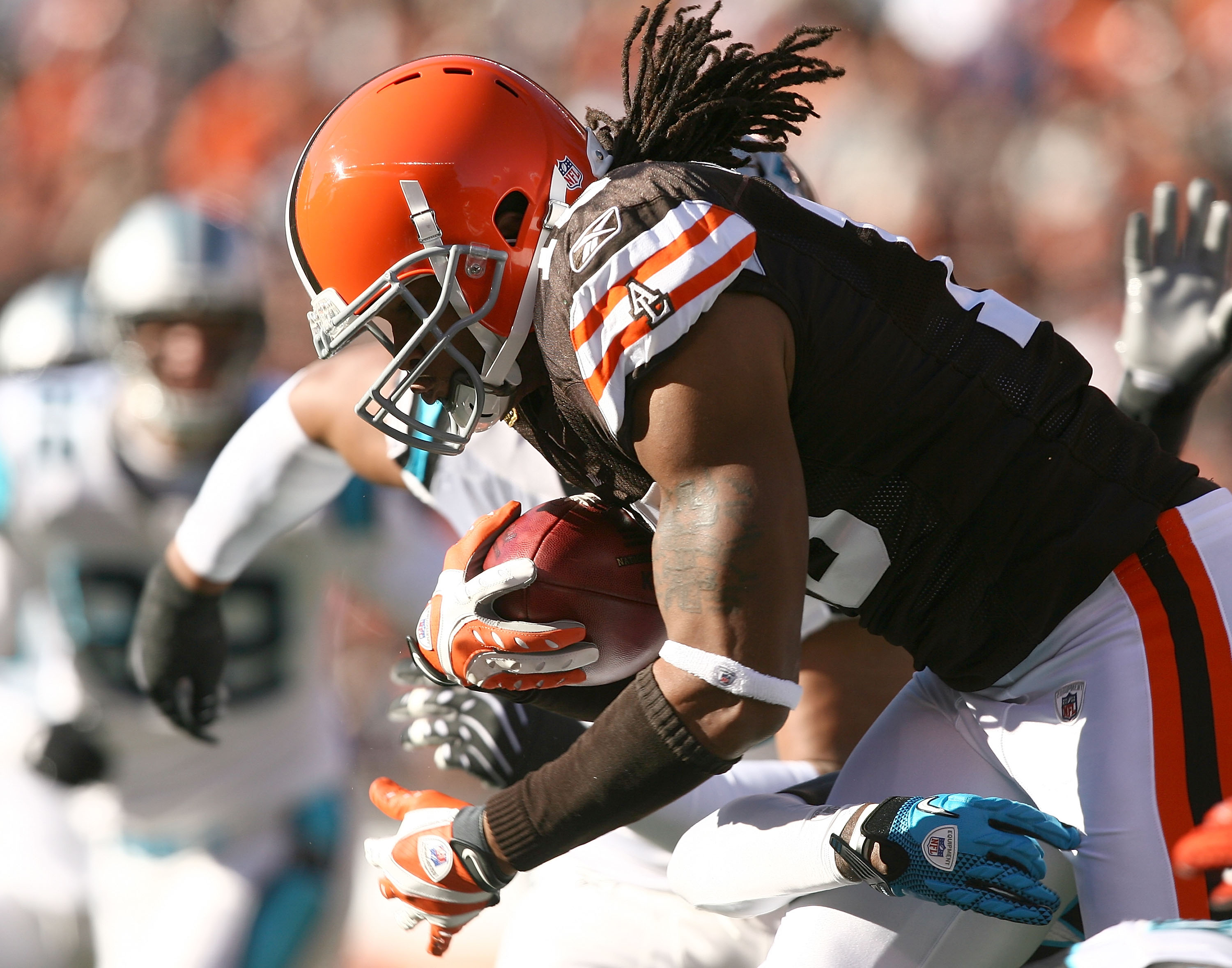 Cleveland Browns wide receiver Braylon Edwards (17) is brought down by  Atlanta Falcons DeAngelo Hall (21) after a pass reception in the first  quarter at the Georgia Dome in Atlanta, November 12