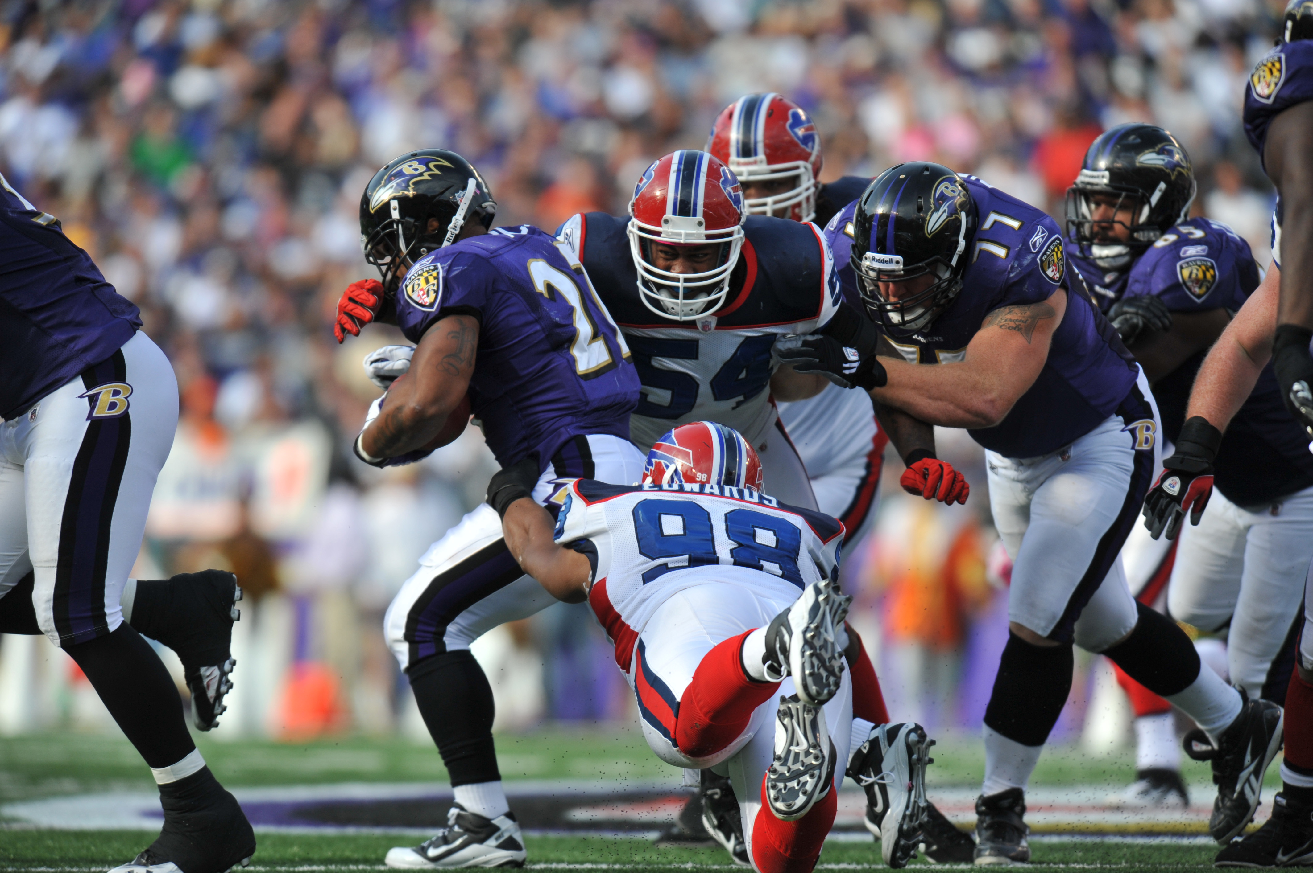 Steven Jackson of the St. Louis Rams is tackled by Aaron Schobel of News  Photo - Getty Images