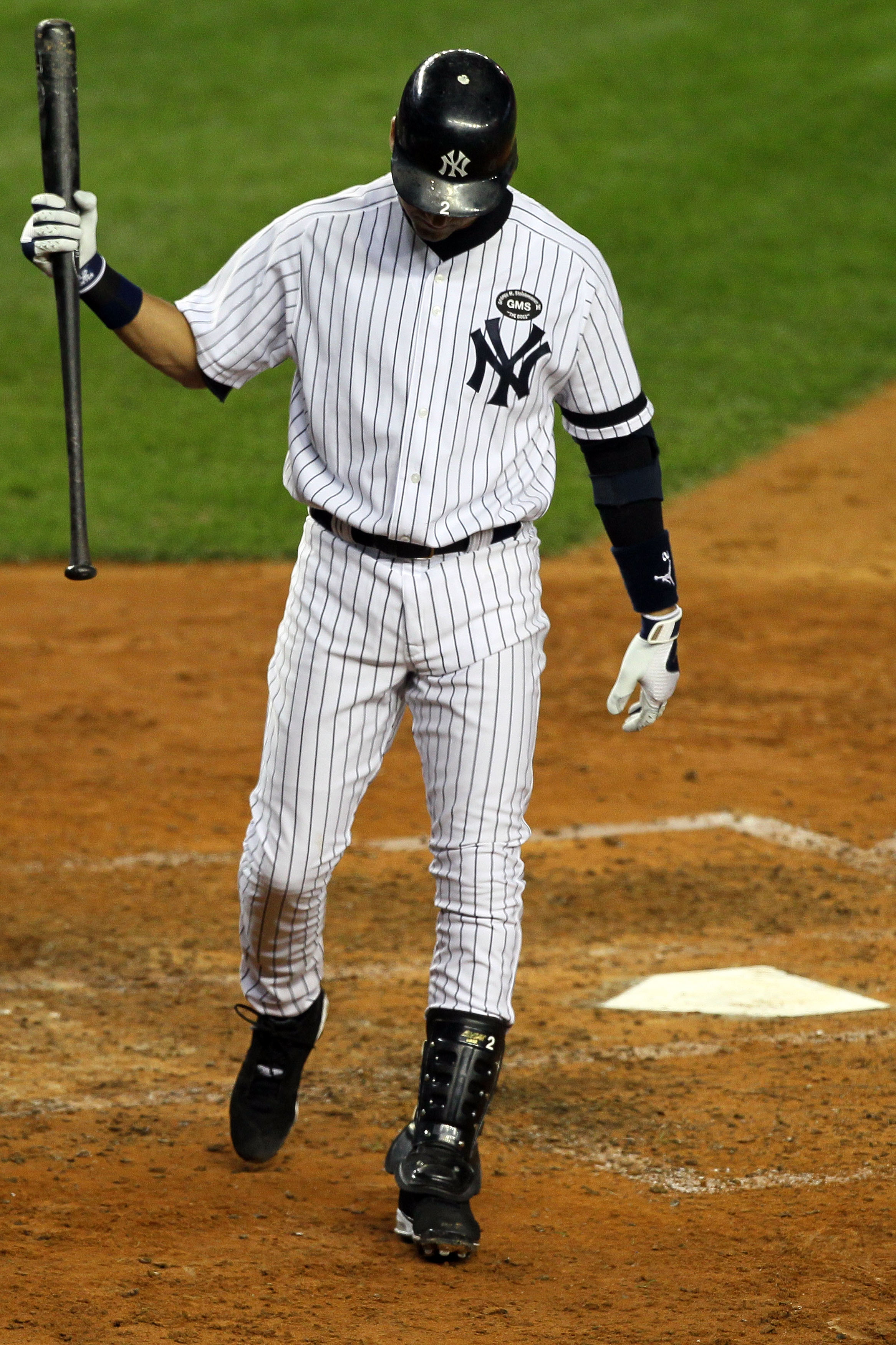 NEW YORK - OCTOBER 18:  Derek Jeter #2 of the New York Yankees reacts after he struck out in the bottom of the sixht inning against the Texas Rangers in Game Three of the ALCS during the 2010 MLB Playoffs at Yankee Stadium on October 18, 2010 in New York,