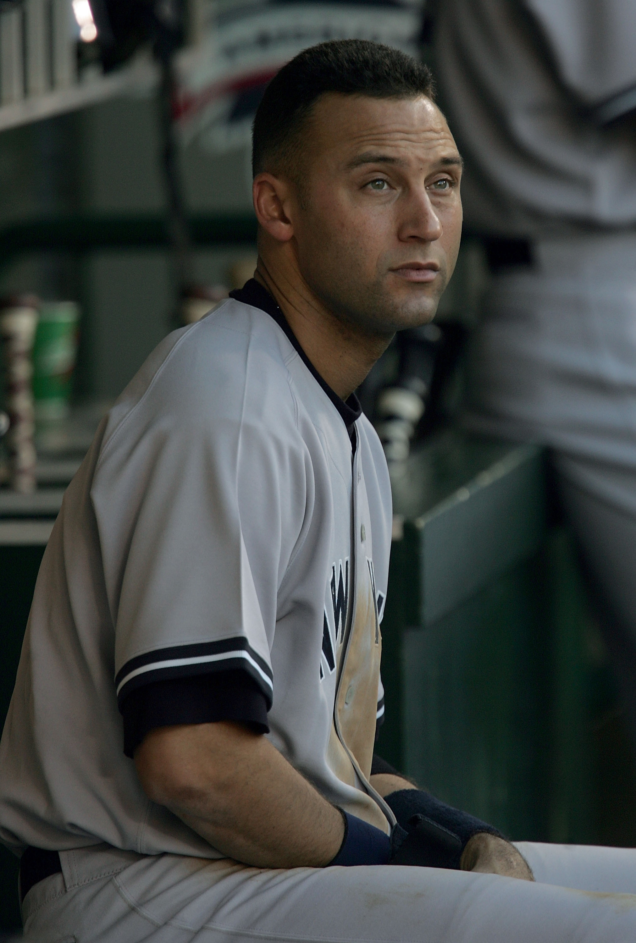 ANAHEIM, CA - OCTOBER 10:  Derek Jeter #2 of the New York Yankees sits in the dugout early in the game against the Los Angeles Angels of Anaheim during Game Five of the American League Division Series on October 10, 2005 at Angel Stadium in Anaheim, Calif
