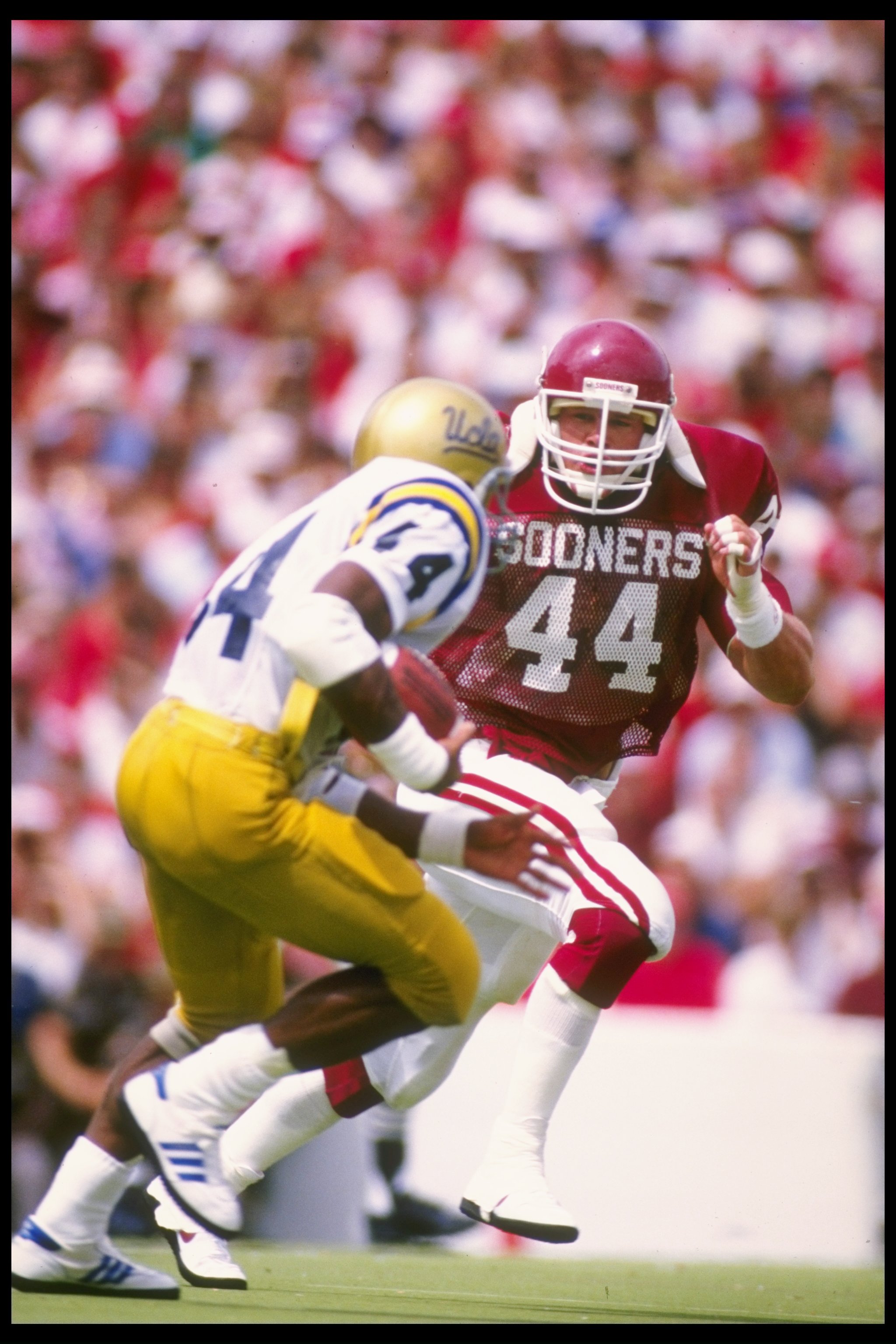 6 Sep 1986:  Linebacker Brian Bosworth (right) of the University of Oklahoma pursues a UCLA running back during the Sooners 38-3 win over UCLA at Memorial Stadium in Norman, Oklahoma. Mandatory Credit: Allsport  /Allsport