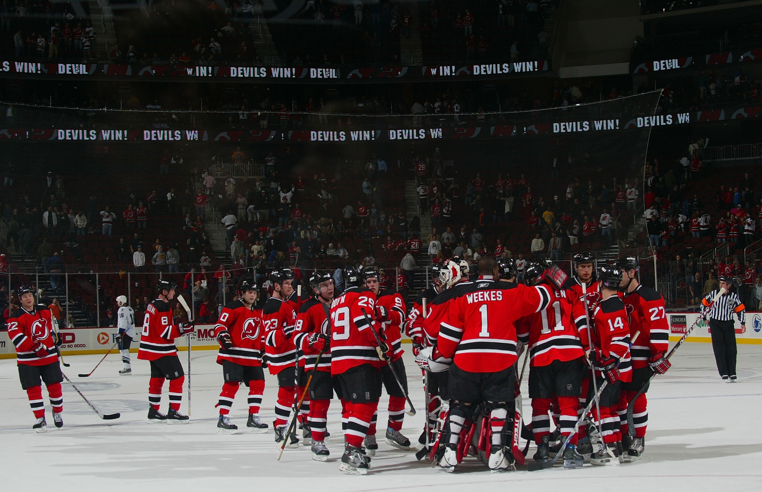 NEWARK, NJ - OCTOBER 31: The New Jersey Devils celebrate a 6-1 victory over the Tampa Bay Lightning October 31, 2007 at the Prudential Center in Newark, New Jersey.  (Photo by Bruce Bennett/Getty Images)
