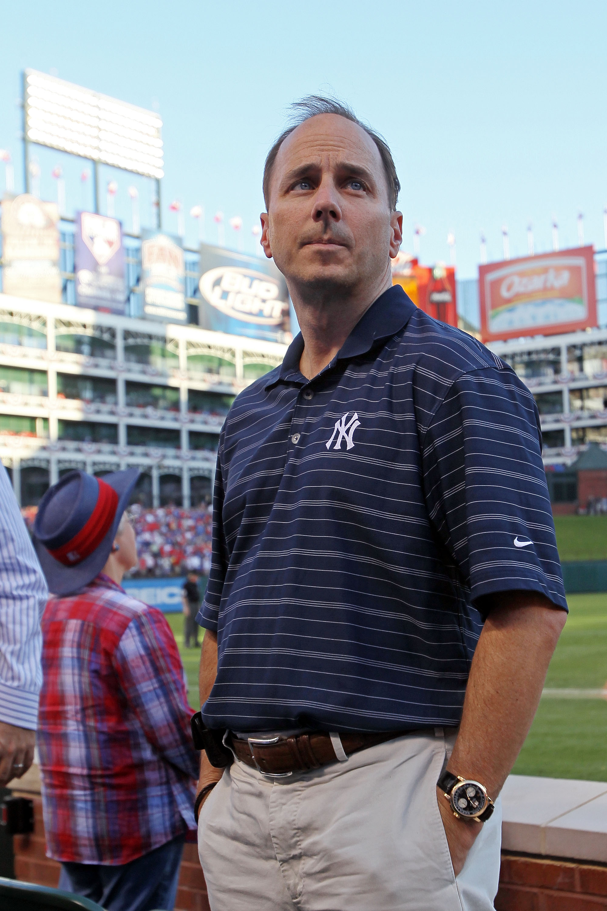 ARLINGTON, TX - OCTOBER 16:  General Manager of the New York Yankees Brian Cashman looks on during a game against the Texas Rangers in Game Two of the ALCS during the 2010 MLB Playoffs at Rangers Ballpark in Arlington on October 16, 2010 in Arlington, Tex