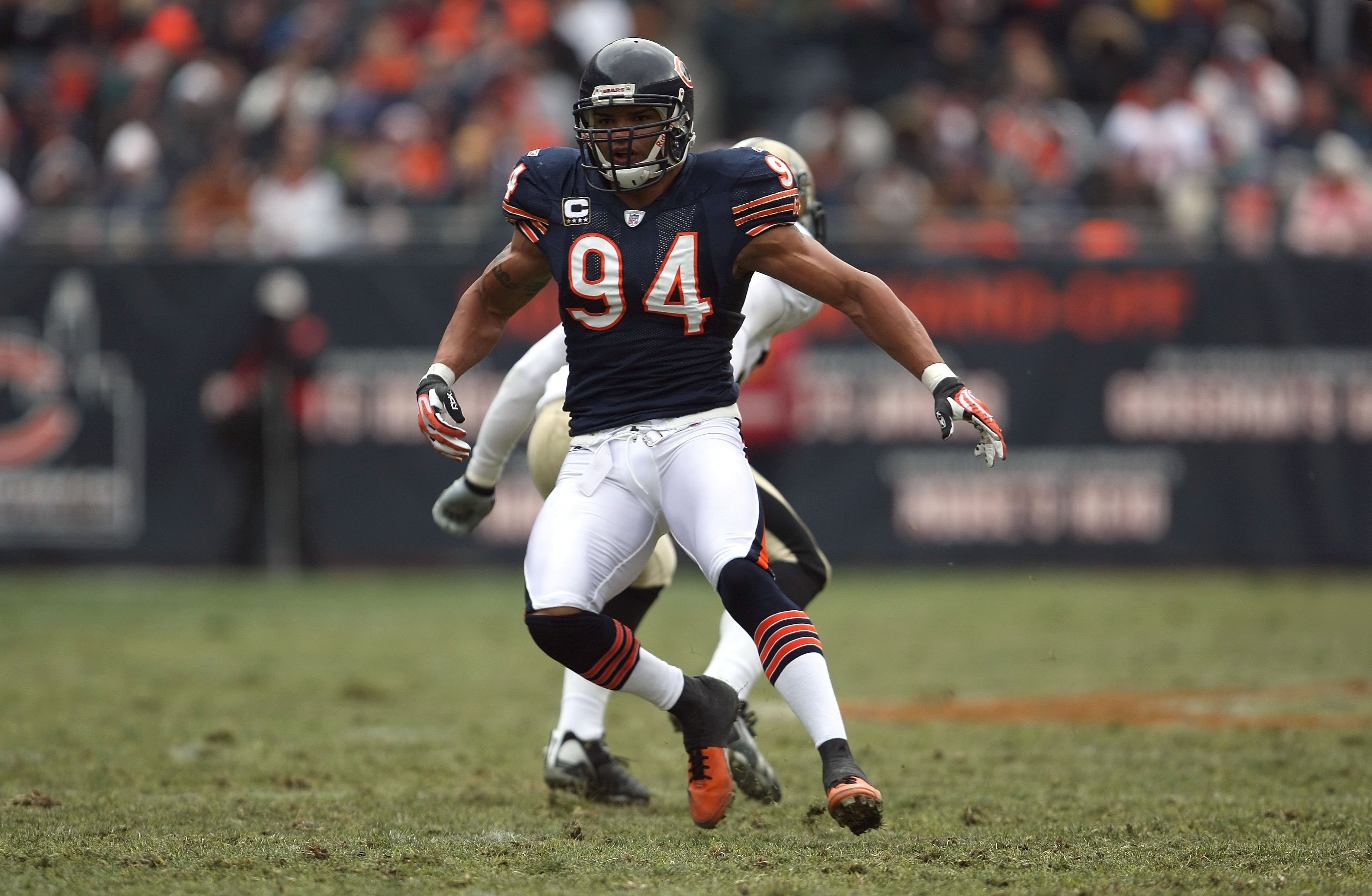 Chicago Bears linebacker Brendon Ayanbadejo (94) lifts off his helmet in  the fourth quarter of a football game against Dallas Cowboys Sunday, Sept.  23, 2007 in Chicago. (AP Photo/Nam Y. Huh Stock