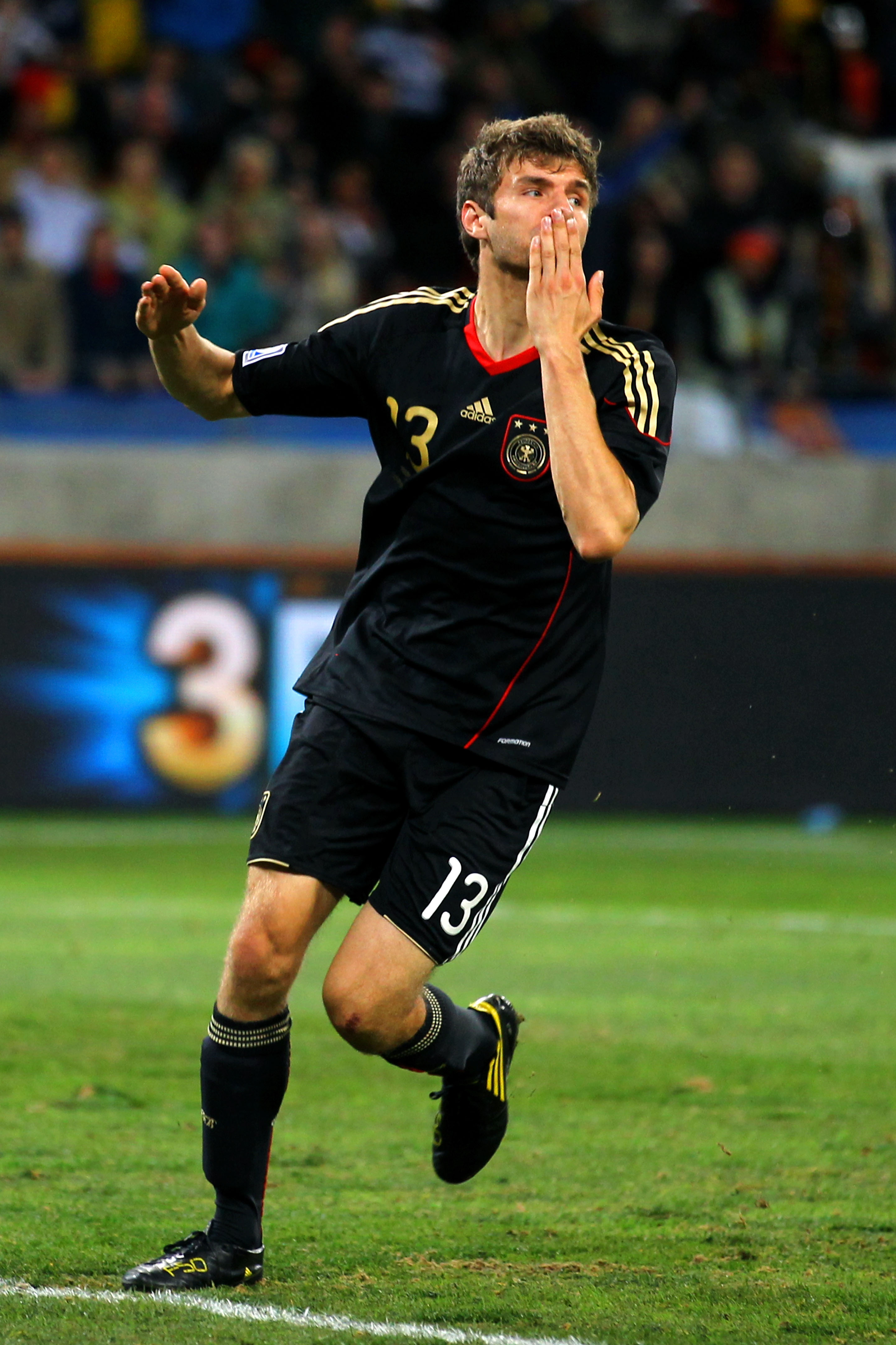 PORT ELIZABETH, SOUTH AFRICA - JULY 10: Thomas Mueller of Germany celebrates scoring the opening goal during the 2010 FIFA World Cup South Africa Third Place Play-off match between Uruguay and Germany at The Nelson Mandela Bay Stadium on July 10, 2010 in