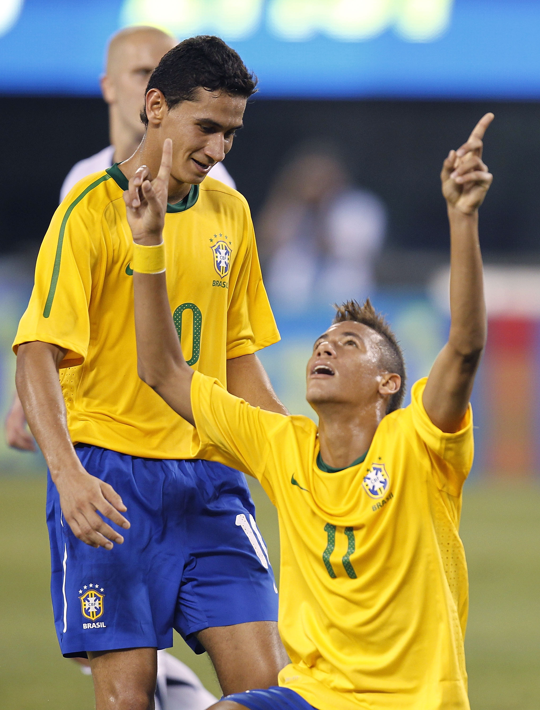 EAST RUTHERFORD, NJ - AUGUST 10: Neymar #11 and Paulo Henrique Ganso #10 of Brazil celebrate Neymar's goal against the U.S. in the first half of a friendly match at the New Meadowlands on August 10, 2010 in East Rutherford, New Jersey. (Photo by Jeff Zele
