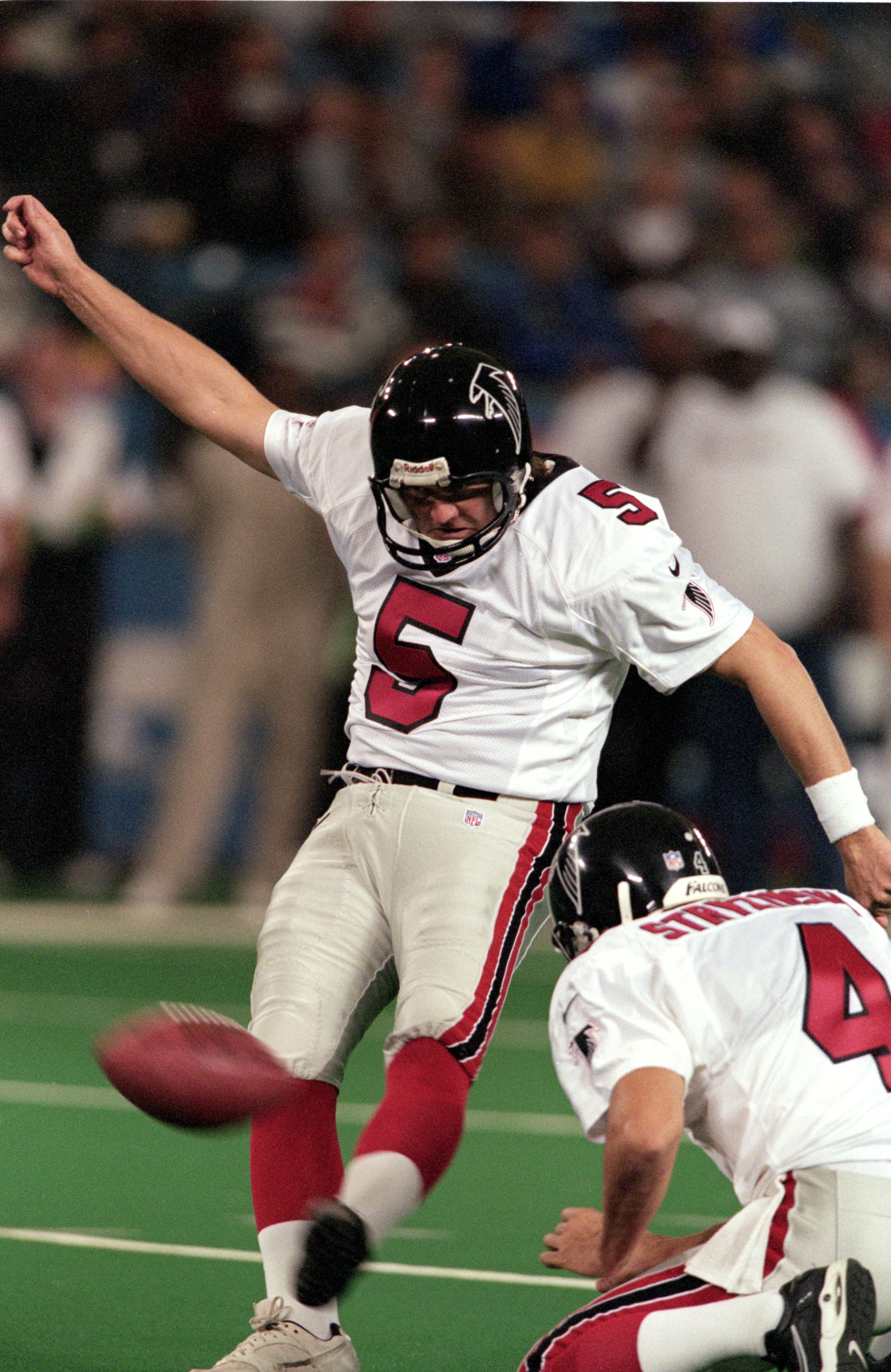12 Nov 2000:  Morten Andersen #5 of the Atlanta Falcons kicks the ball as teammate Dan Stryzinski #4 held it for him during the game against the Detroit Lions at the Silverdome in Pontiac, Michigan. The Lions defeated the Falcons 13-10.Mandatory Credit: T