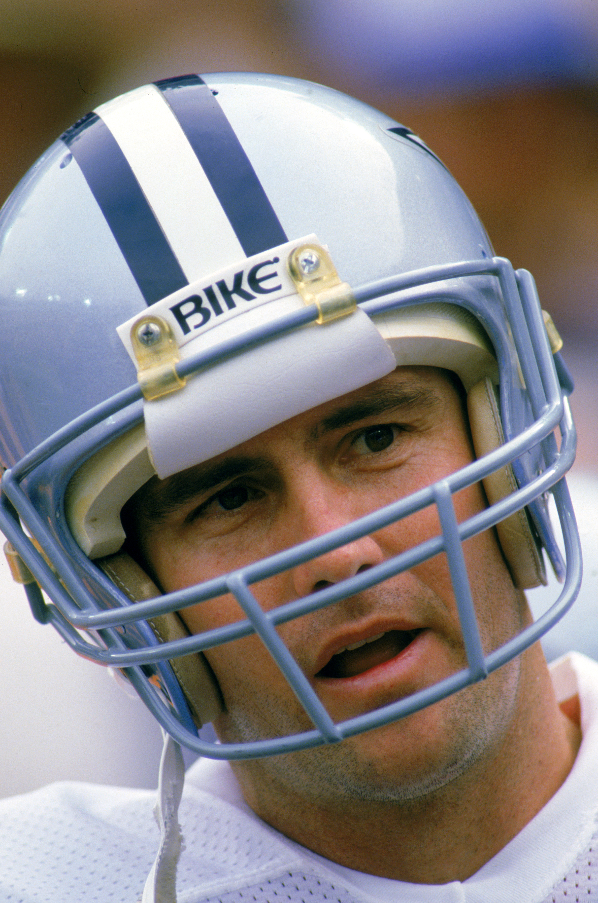 ANAHEIM -1986:  Quarterback Danny White #11 of the Dallas Cowboys talks on the sidelines during a playoff game against the Los Angeles Rams at Anaheim Stadium on January 1,1986 in Anaheim, California. The Rams defeated the Cowboys 20-0.  (Photo by: Mike P