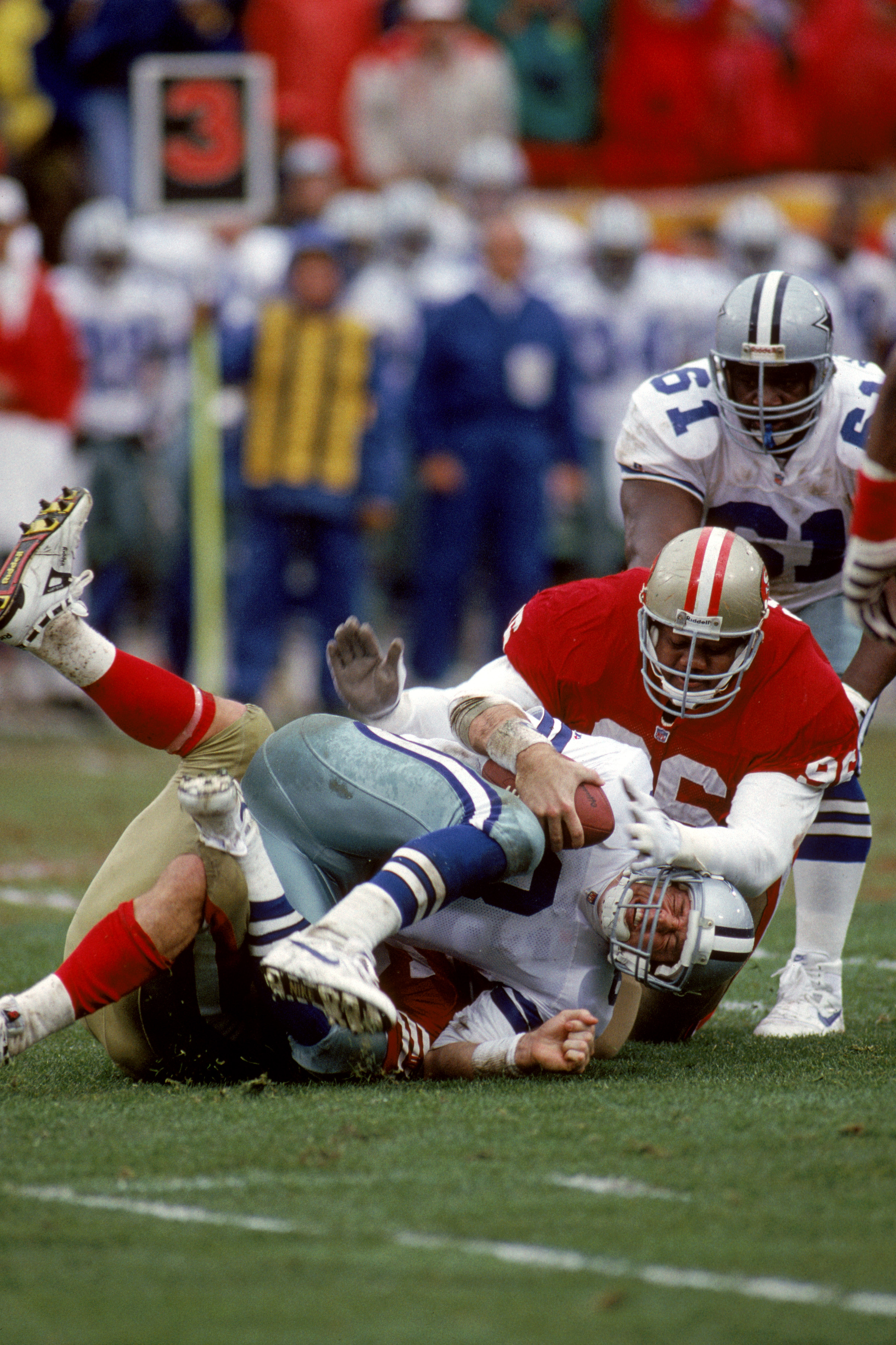SAN FRANCISCO - JANUARY 17:  Quarterback Troy Aikman #8 of the Dallas Cowboys gets sacked during the 1992 NFC Conference Championship game against the San Francisco 49ers at Candlestick Park on January 17, 1993 in San Francisco, California.  The Cowboys w