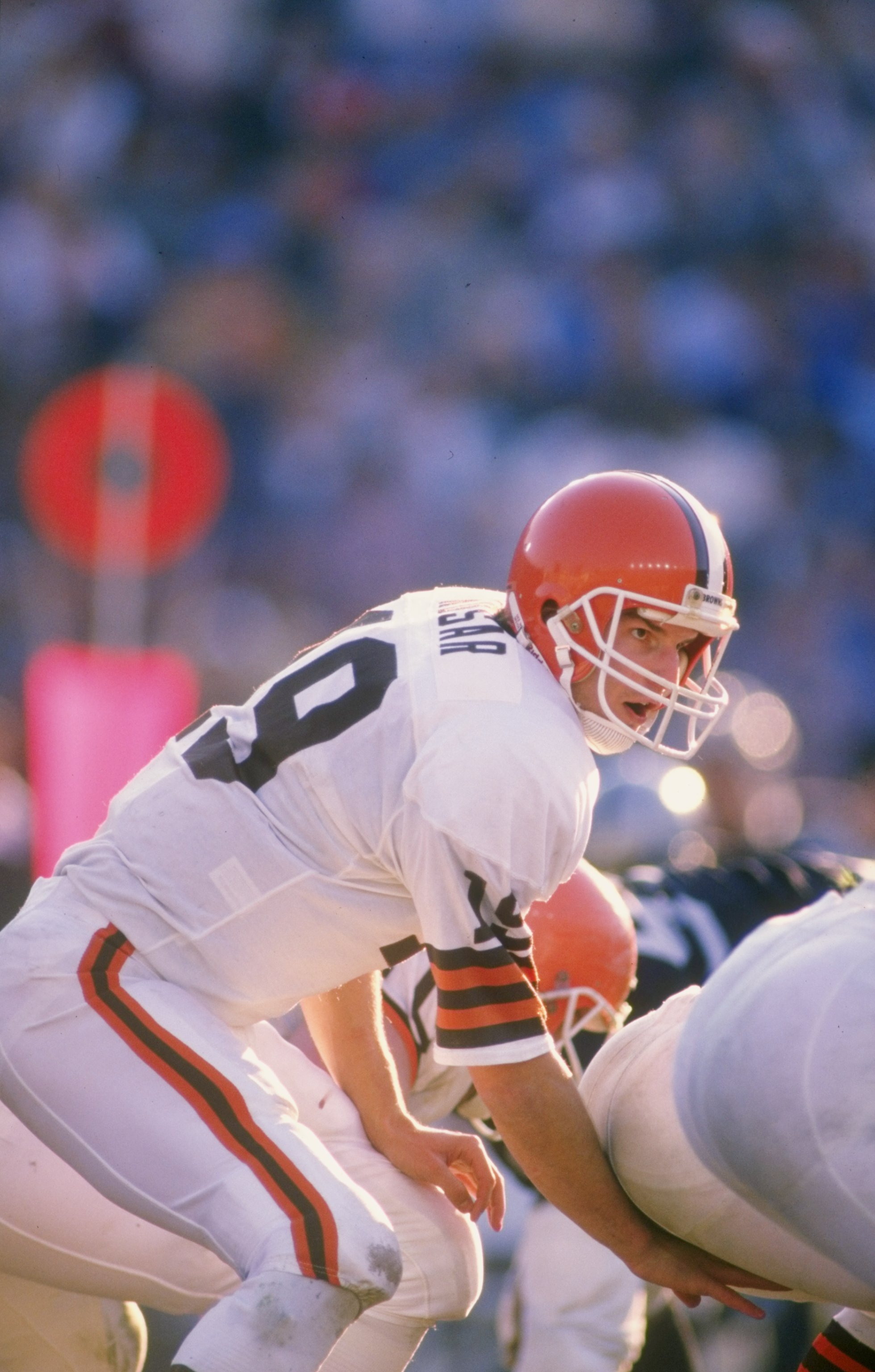 Quarterback Bernie Kosar of the Cleveland Browns calls signals at the line during a game against the Los Angeles Raiders at the Los Angeles Memorial Coliseum in Los Angeles, California. The Browns won the game 24-17.