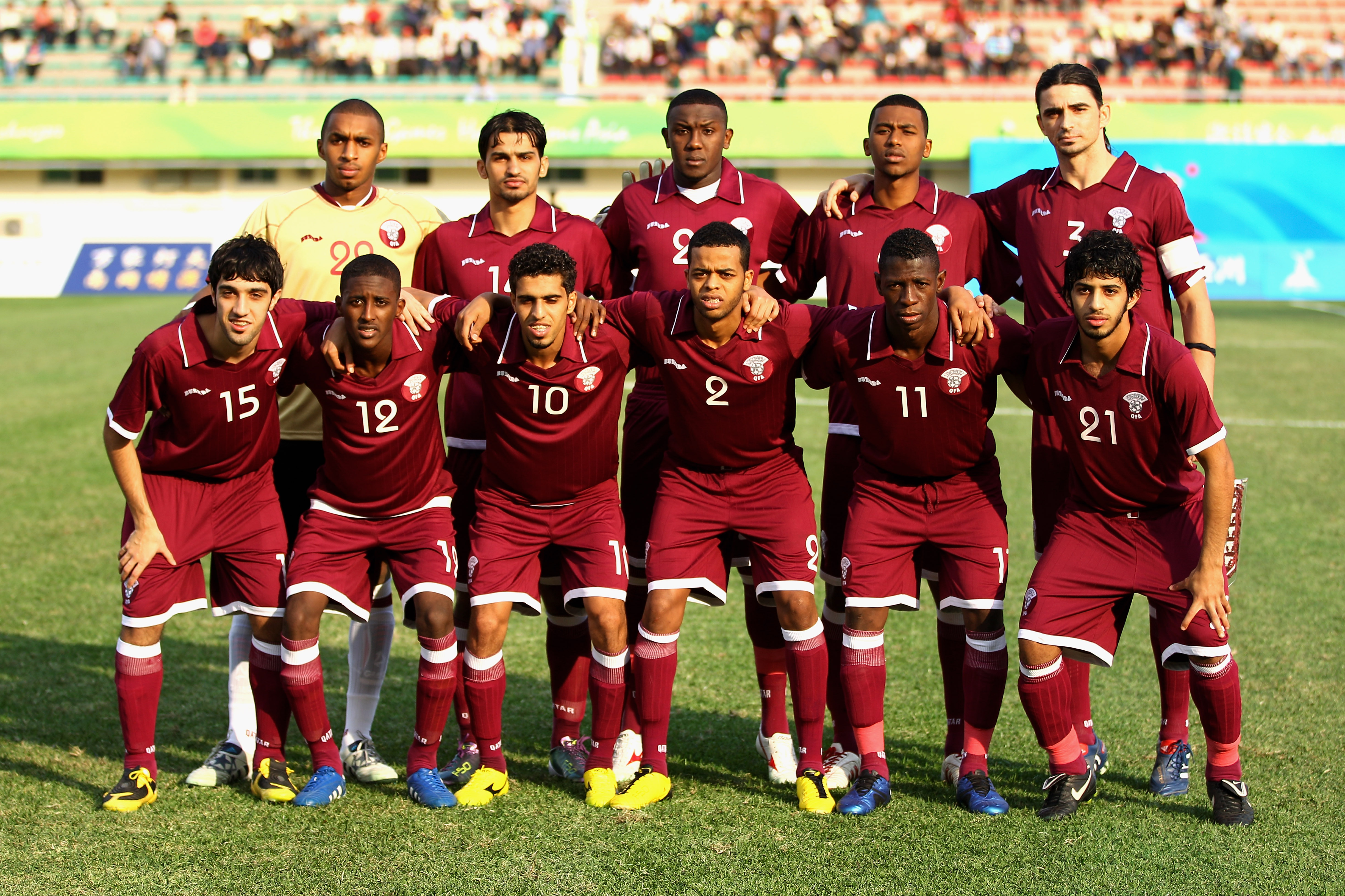 GUANGZHOU, CHINA - NOVEMBER 09:  The Qatar team pose for the cameras prior to kickoff during the Men's Football group D pool match between Qatar and India ahead of the 16th Asian Games Guangzhou 2010 at Huadu Stadium on November 9, 2010 in Guangzhou, Chin