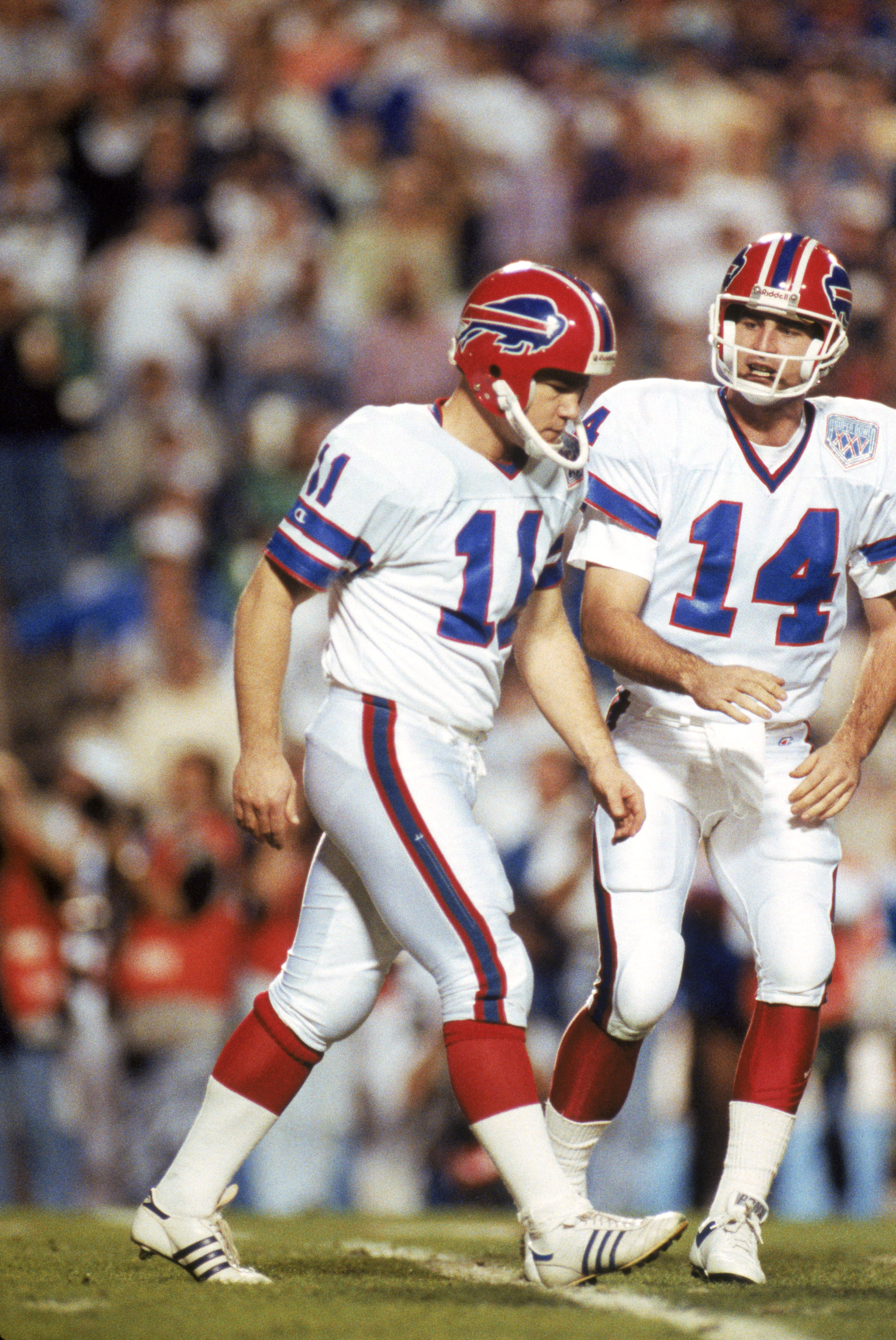 TAMPA, FL - JANUARY 27:  Kicker Scott Norwood #11 and  quarterback Frank Reich #14 of the Buffalo Bills walk n the field during Super Bowl XXV against the New York Giants at Tampa Stadium on January 27, 1991 in Tampa, Florida.  The Giants won 20-19.  (Pho