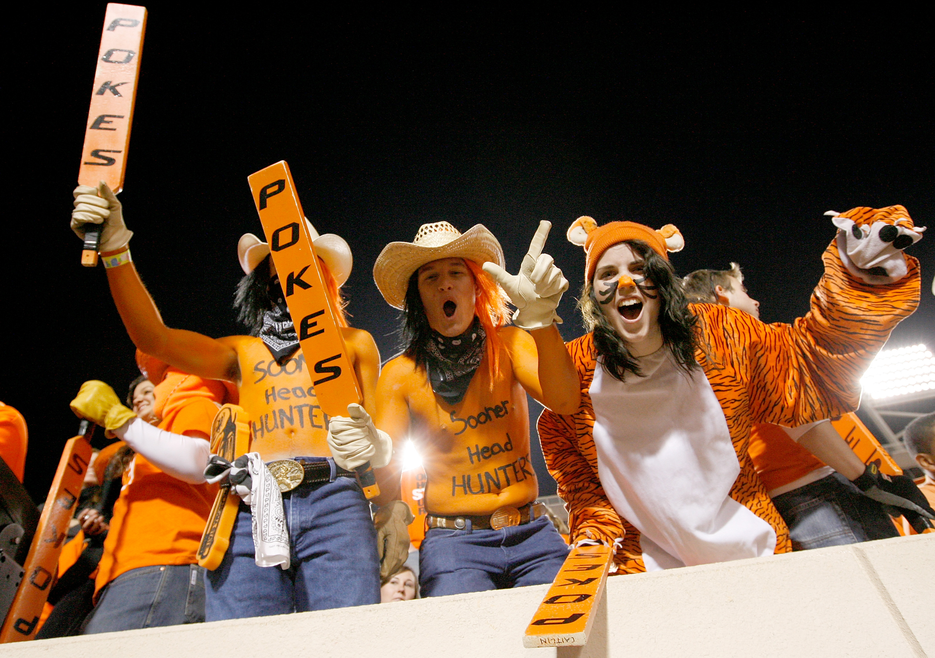 STILLWATER, OK - NOVEMBER 27:  Oklahoma State Cowboy fans cheer on their team as the Cowboys prepare to take on the Oklahoma Soones at Boone Pickens Stadium on November 27, 2010 in Stillwater, Oklahoma.  (Photo by Tom Pennington/Getty Images)
