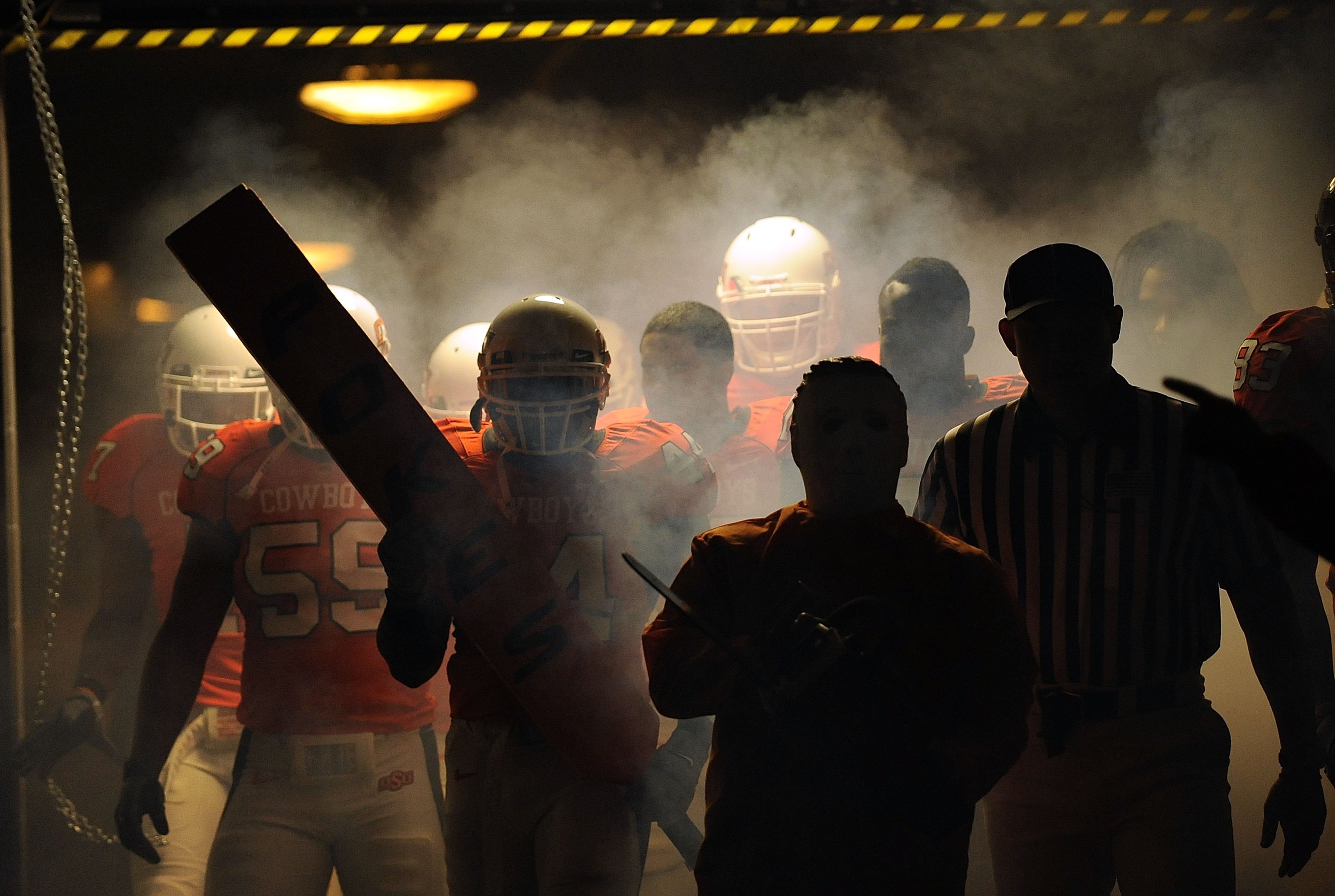STILLWATER, OK - OCTOBER 31:  The Oklahoma State Cowboys make their way through the tunnel before taking on the Texas Longhorns at Boone Pickens Stadium on October 31, 2009 in Stillwater, Oklahoma.  (Photo by Ronald Martinez/Getty Images)