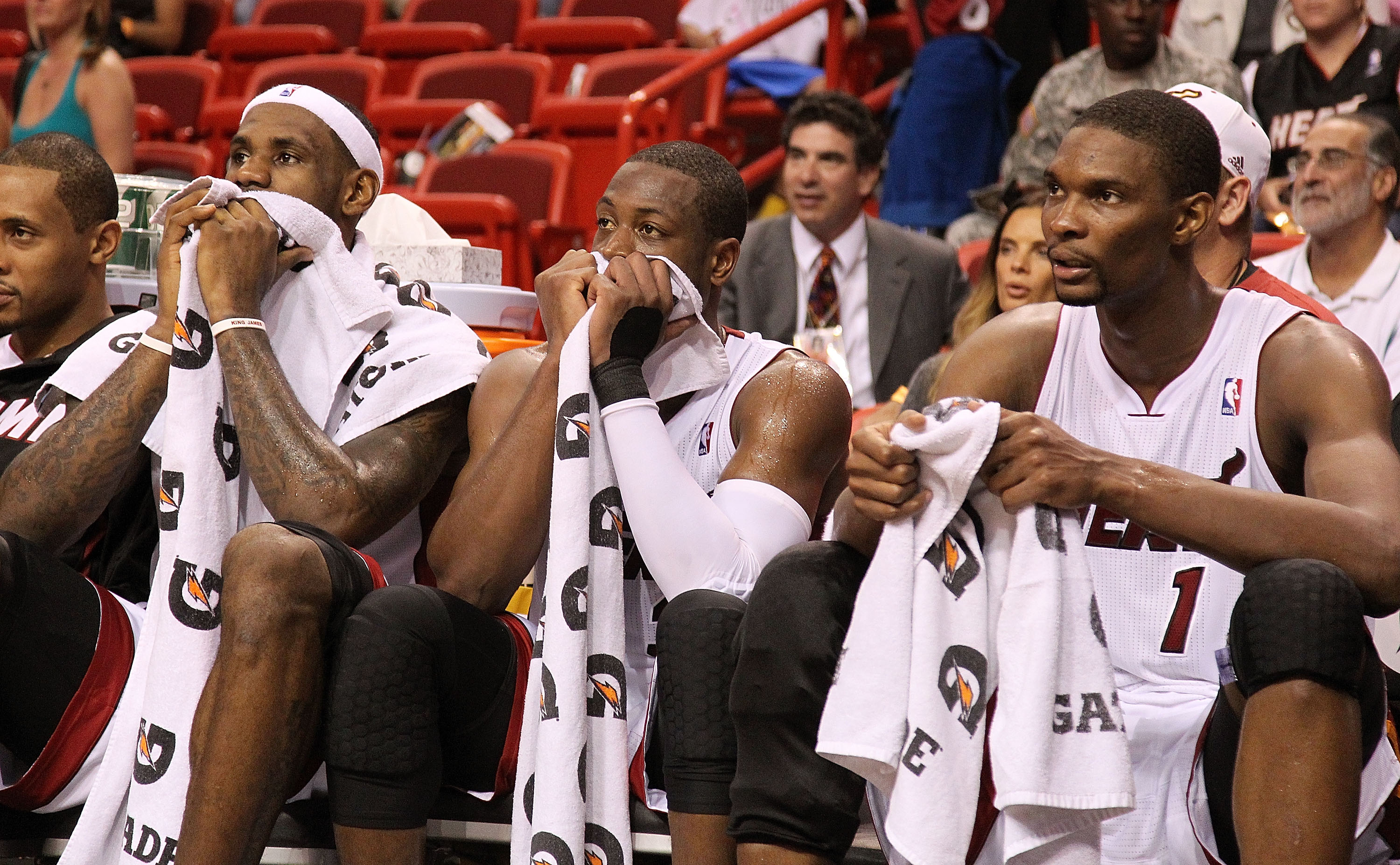 MIAMI, FL - NOVEMBER 29:  LeBron James #6, Dwyane Wade #3, and Chris Bosh #1 of the Miami Heat sit on the bench during a game against the Washington Wizards at American Airlines Arena on November 29, 2010 in Miami, Florida. NOTE TO USER: User expressly ac