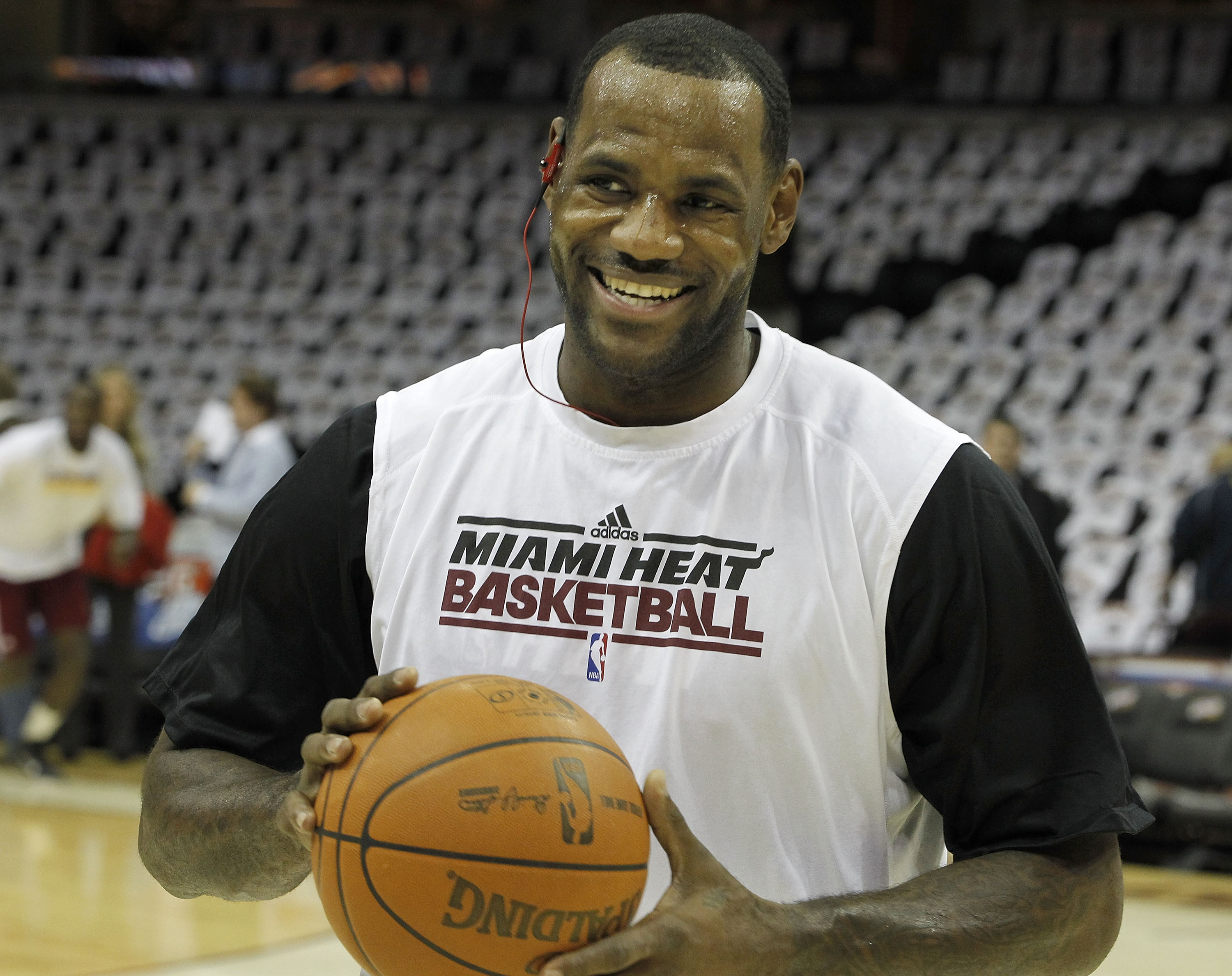 CLEVELAND, OH - DECEMBER 02:  LeBron James #6 of the Miami Heat smiles as he warms up prior to playing the Cleveland Cavaliers at Quicken Loans Arena on December 2, 2010 in Cleveland, Ohio.  NOTE TO USER: User expressly acknowledges and agrees that, by do