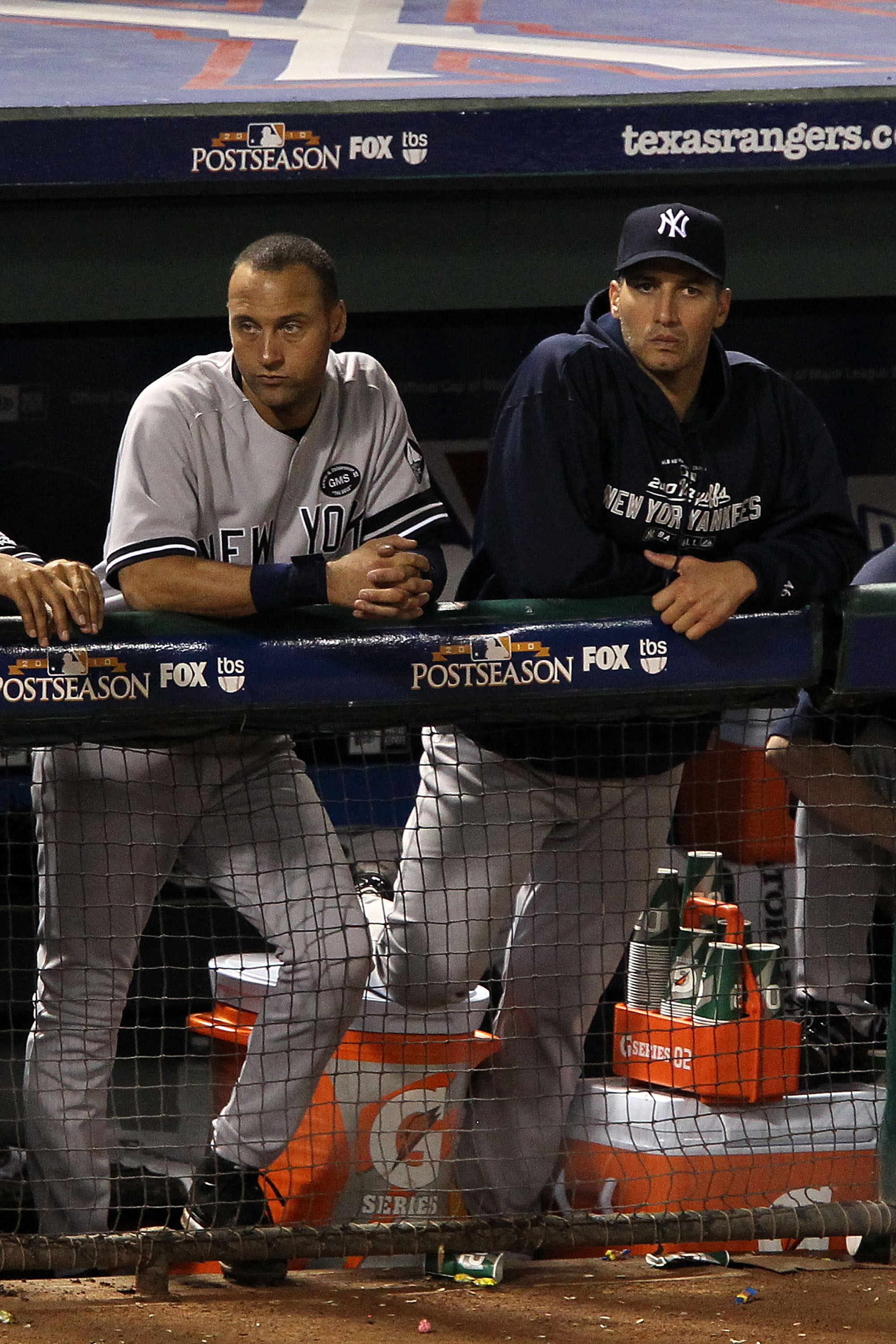 ARLINGTON, TX - OCTOBER 22:  Derek Jeter #2 and Andy Pettitte #46 of the New York Yankees look on from the dugout in Game Six of the ALCS against the Texas Rangers during the 2010 MLB Playoffs at Rangers Ballpark in Arlington on October 22, 2010 in Arling