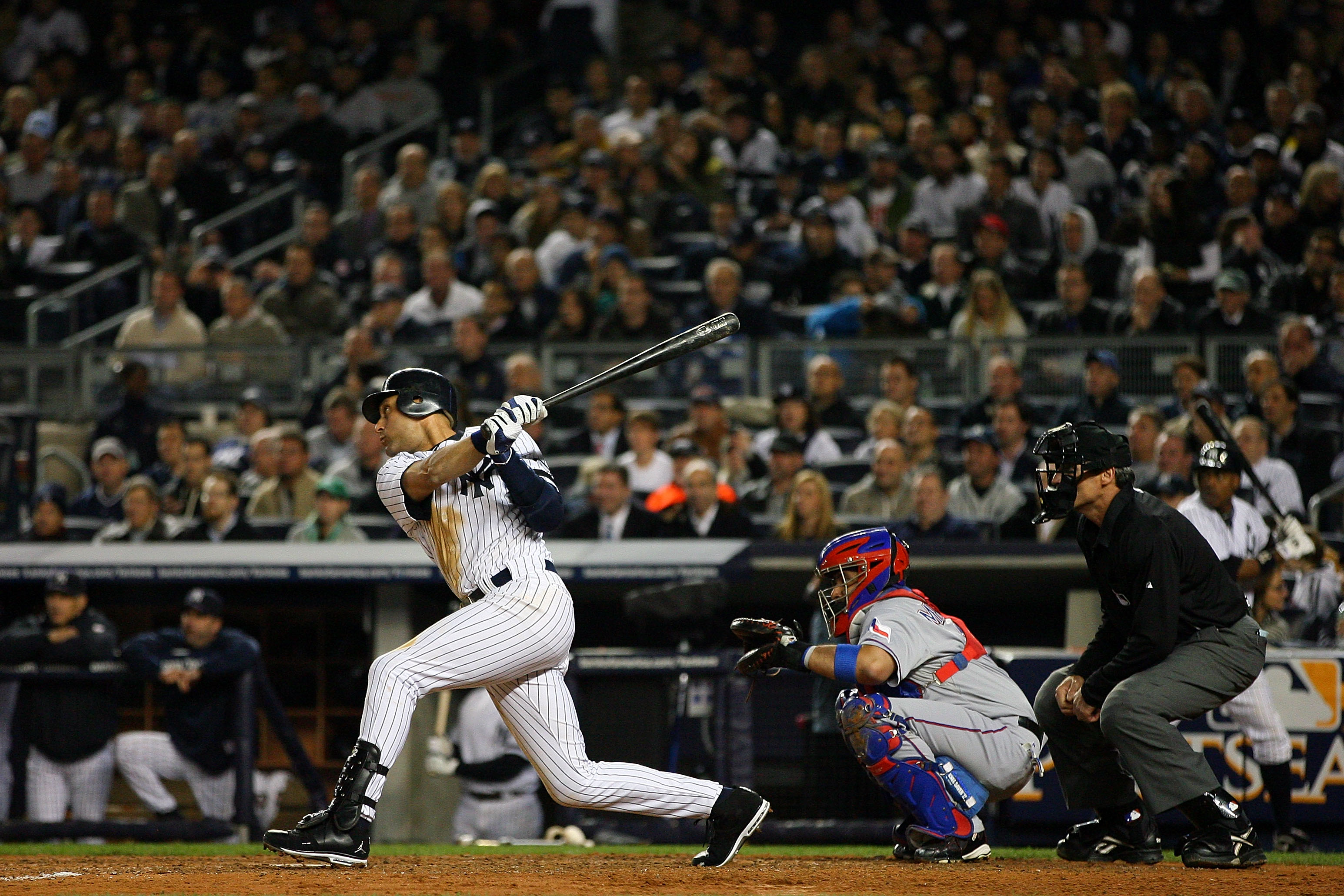 NEW YORK - OCTOBER 19:  Derek Jeter #2 of the New York Yankees hits a double in the fifth inning against the Texas Rangers in Game Four of the ALCS during the 2010 MLB Playoffs at Yankee Stadium on October 19, 2010 in the Bronx borough of New York City.