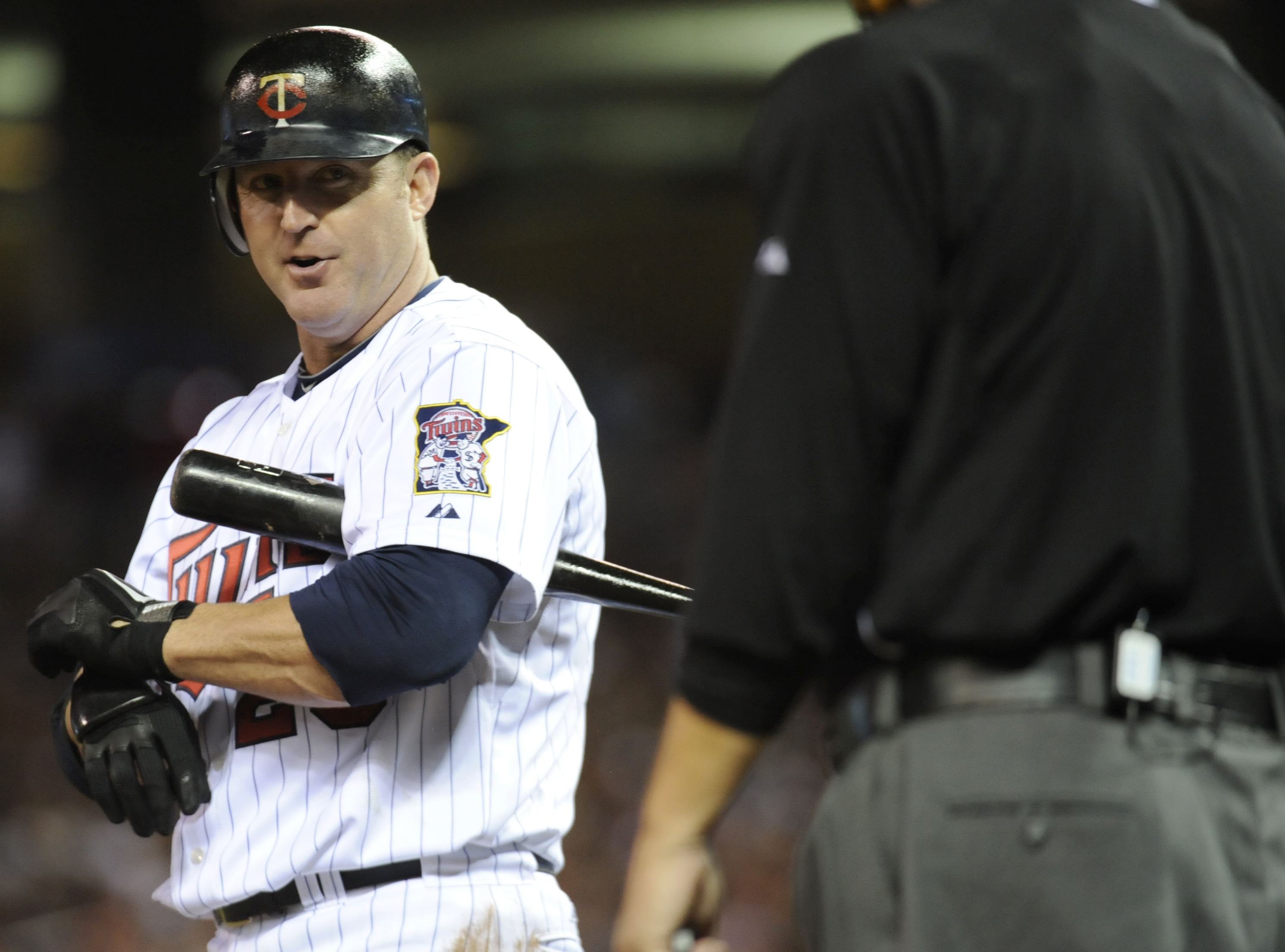 MINNEAPOLIS, MN - OCTOBER 6: Jim Thome #25 of the Minnesota Twins speaks with home plate umpire Jerry Crawford #2 during game one of the ALDS against the New York Yankees on October 6, 2010 at Target Field in Minneapolis, Minnesota. (Photo by Hannah Fosli