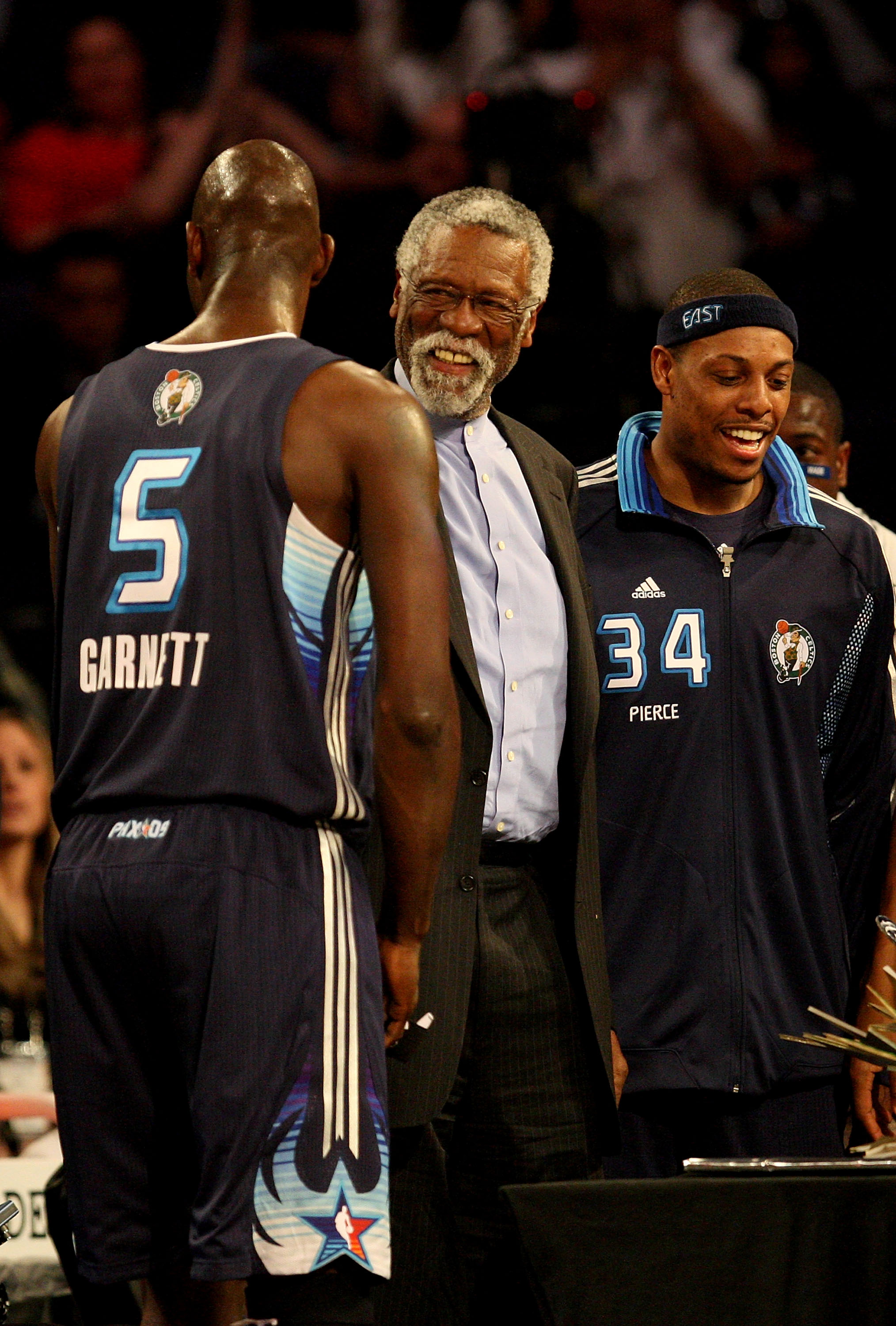 PHOENIX - FEBRUARY 15:  Kevin Garnett #5 and Paul Pierce #34 of the Eastern Conference present a birthday cake to NBA legend Bill Russell, center, during the 58th NBA All-Star Game, part of 2009 NBA All-Star Weekend at US Airways Center on February 15, 20