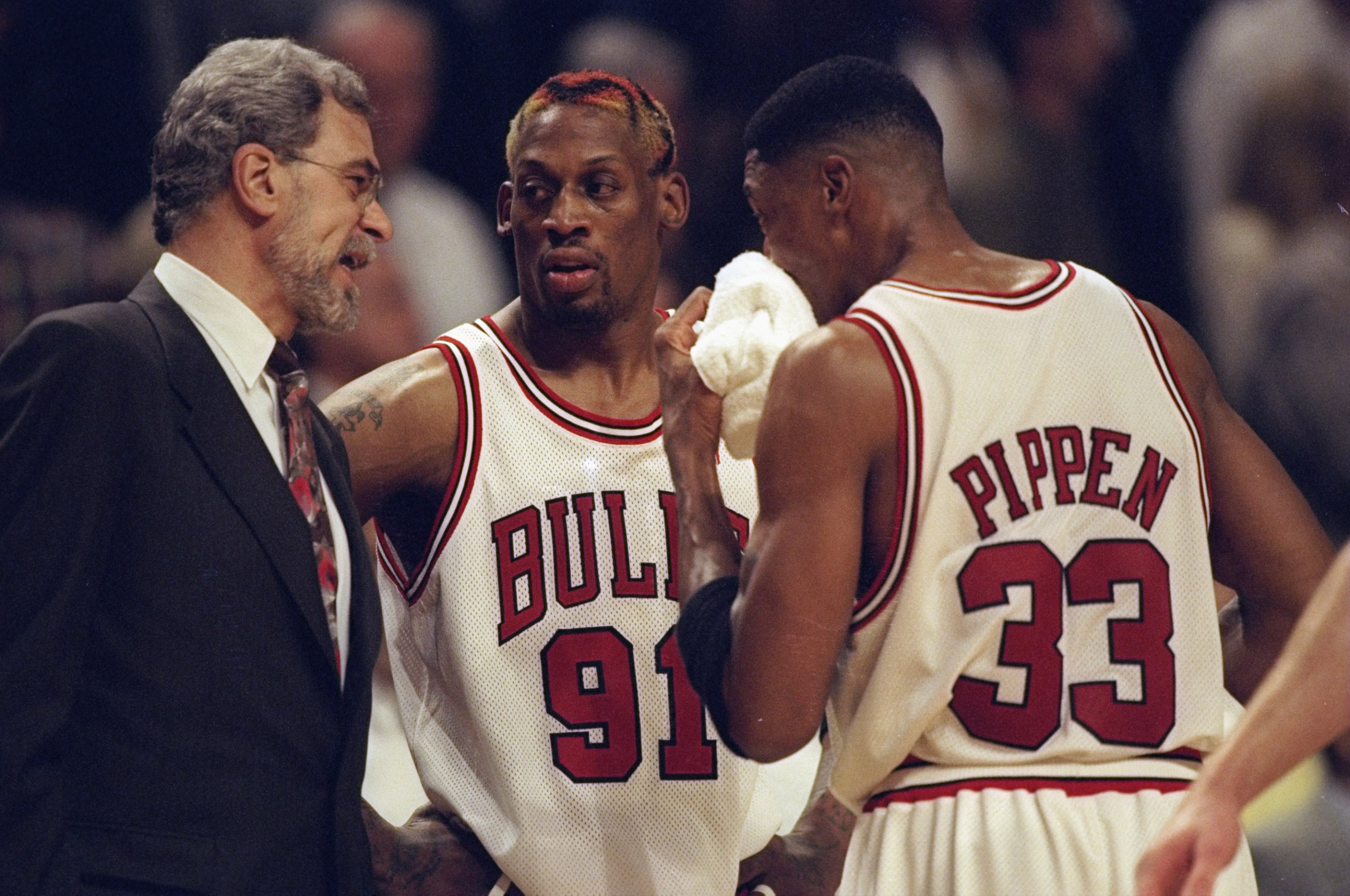 13 May 1998: Dennis Rodman #91and Scottie Pippen #33 of the  Chicago Bulls listen to head coach Phil Jackson during the game against the Charlotte Hornets at the United Center in Chicago, Illinios. The Bulls defeated the Hornets 93-84. Mandatory Credit: J