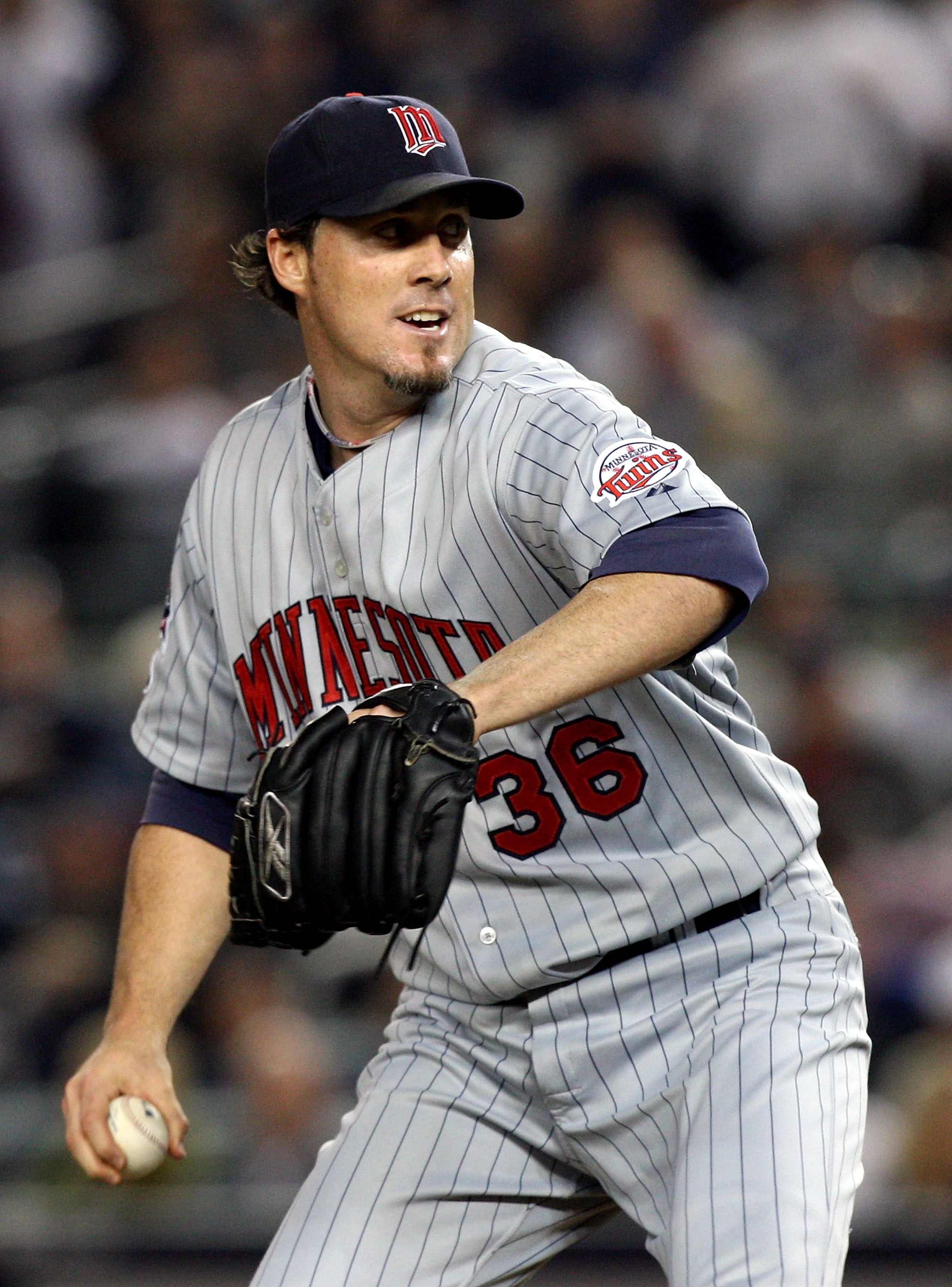NEW YORK - OCTOBER 09:  Joe Nathan #36 of the Minnesota Twins pitches against the New York Yankees in Game Two of the ALDS during the 2009 MLB Playoffs at Yankee Stadium on October 9, 2009 in the Bronx borough of New York City.  (Photo by Jim McIsaac/Gett