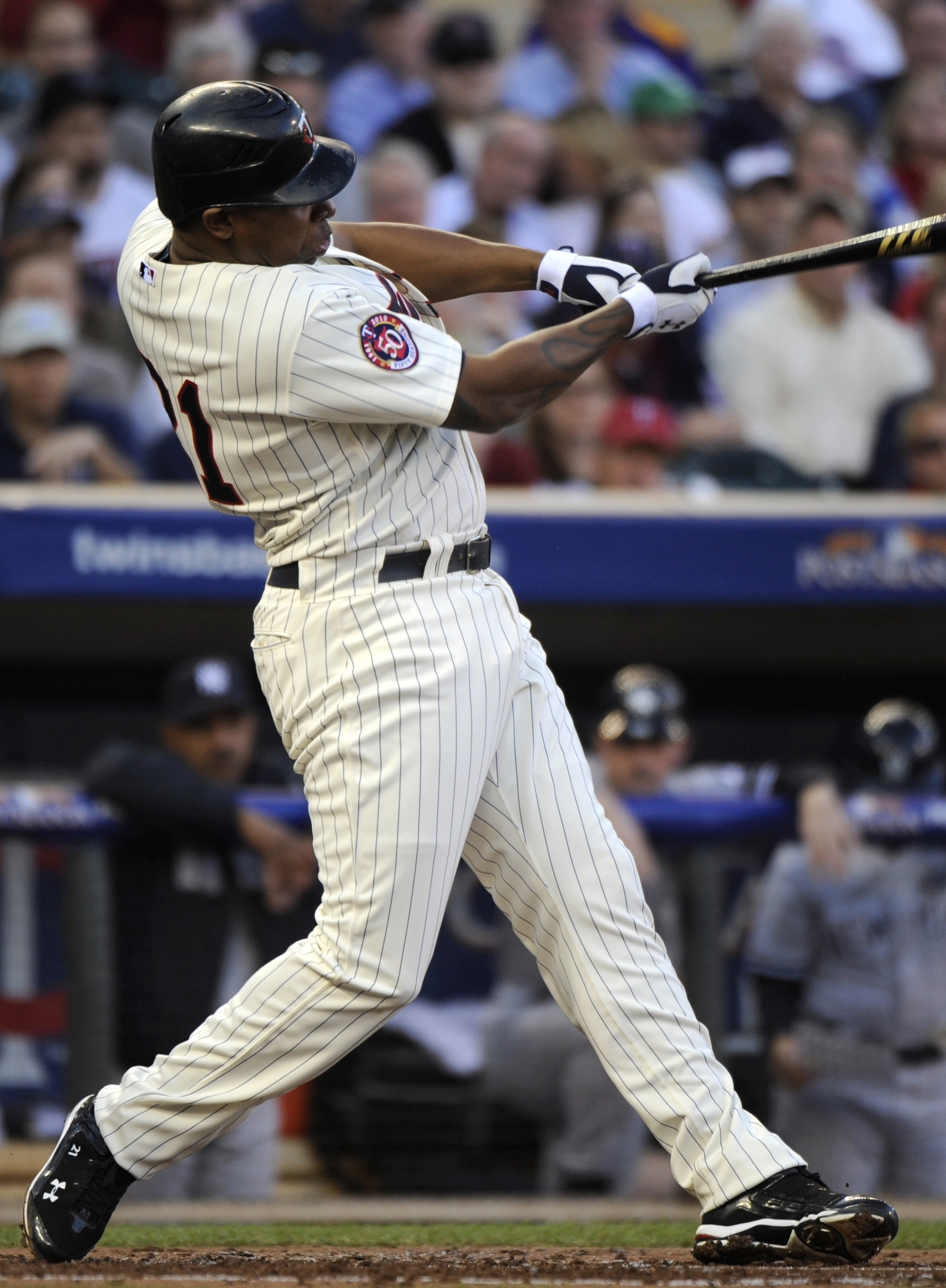 MINNEAPOLIS, MN - OCTOBER 7: Delmon Young #21 of the Minnesota Twins singles during game two of the ALDS game against the New York Yankees on October 7, 2010 at Target Field in Minneapolis, Minnesota.  (Photo by Hannah Foslien/Getty Images)