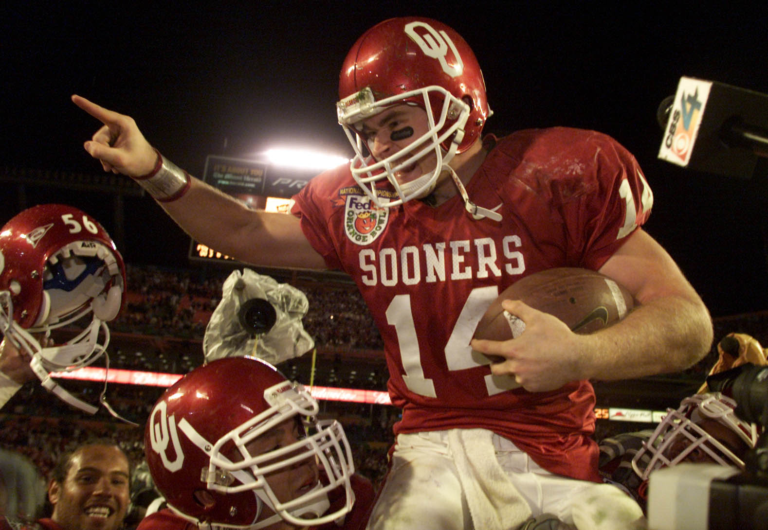 3 Jan 2001: Quarterback Josh Heupel #14 of the Oklahoma Sooners is hoisted by his teammates after defeating the Florida State Seminoles during the Orange Bowl at Pro Player Stadium in Miami, Florida. <DIGITAL IMAGE> Mandatory Credit: Andy Lyons/ALLSPORT
