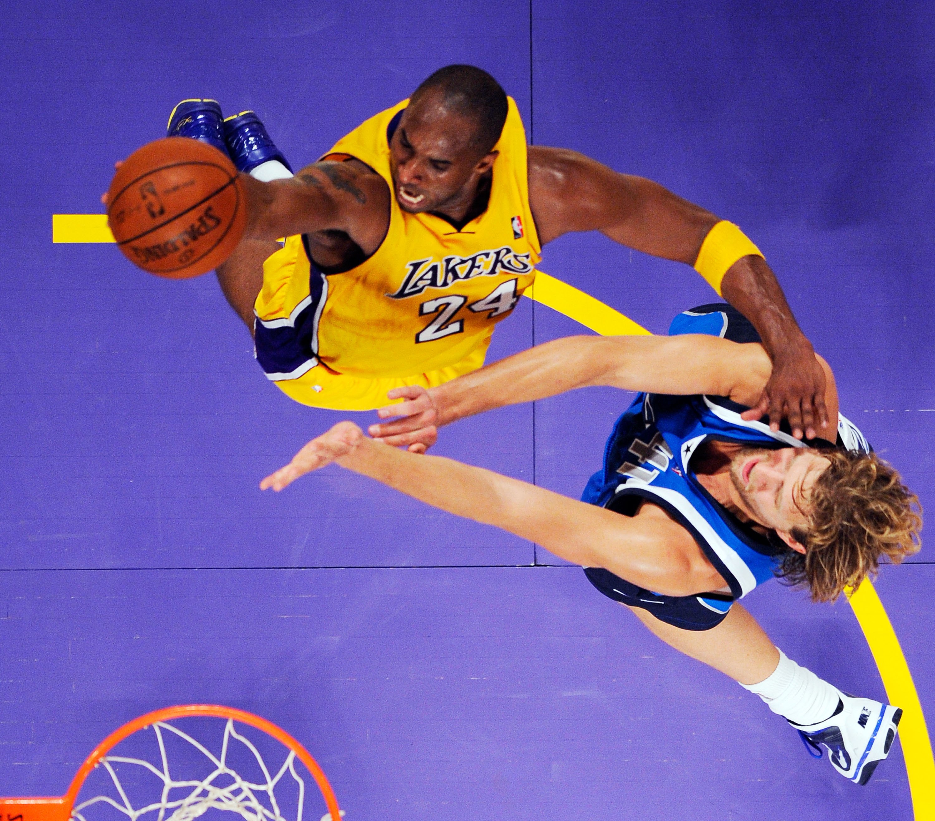 LOS ANGELES, CA - OCTOBER 30: Kobe Bryant #24 of the Los Angeles Lakers glides to the basket against Dirk Nowitzki #41 of the Dallas Mavericks during the NBA basketball game at Staples Center on October 30, 2009 in Los Angeles, California.  NOTE TO USER: