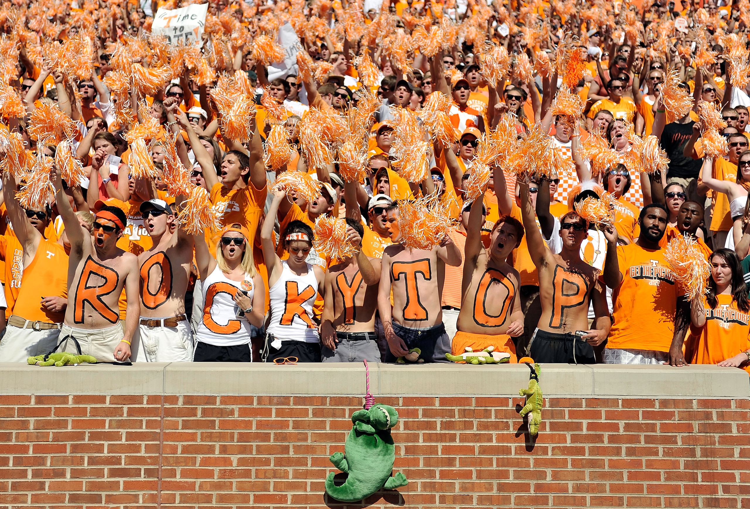 KNOXVILLE, TN - SEPTEMBER 18: Orange-clad Tennessee Volunteers fans sing along with 'Rocky Top' during a game against the Florida Gators at Neyland Stadium on September 18, 2010 in Knoxville, Tennessee. Florida won 31-17. (Photo by Grant Halverson/Getty KNOXVILLE, TN - SEPTEMBER 18: Orange-clad Tennessee Volunteers fans sing along with 'Rocky Top' during a game against the Florida Gators at Neyland Stadium on September 18, 2010 in Knoxville, Tennessee. Florida won 31-17. (Photo by Grant Halverson/Getty