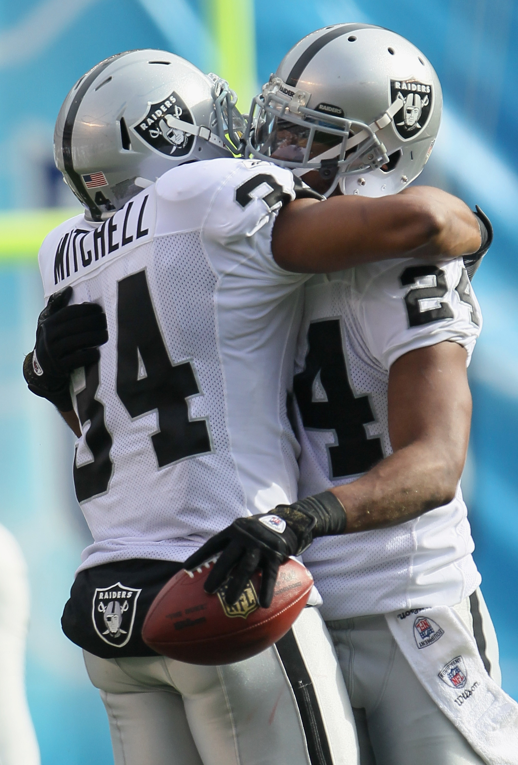 SAN DIEGO - DECEMBER 05:  Safety Michael Huff (R) #24 the Oakland Raiders is congratulated by teammate Mike Mitchell #34 after intercepting a pass against the San Diego Chargers during the first quarter at Qualcomm Stadium on December 5, 2010 in San Diego